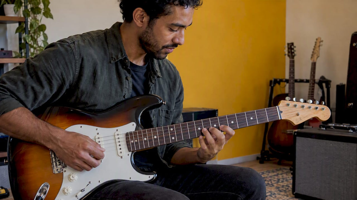 Guitarist playing a scale on electric guitar