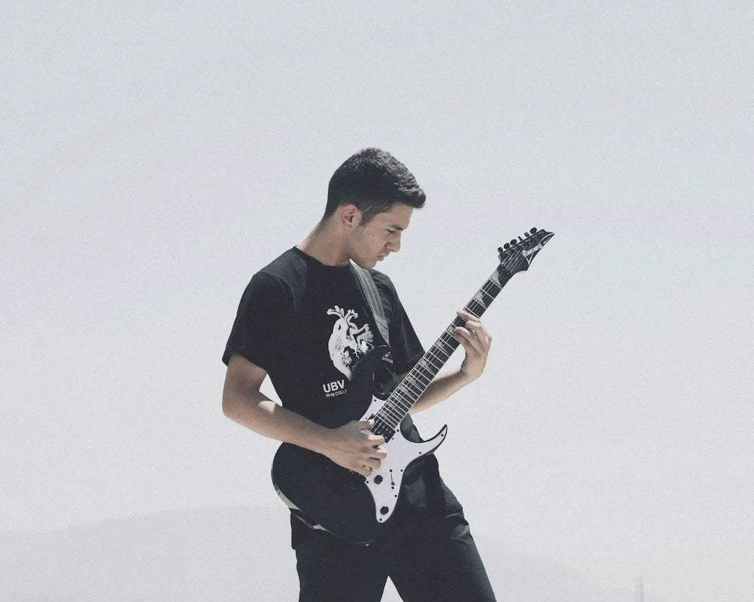 Guitarist practising pentatonic fretboard positions