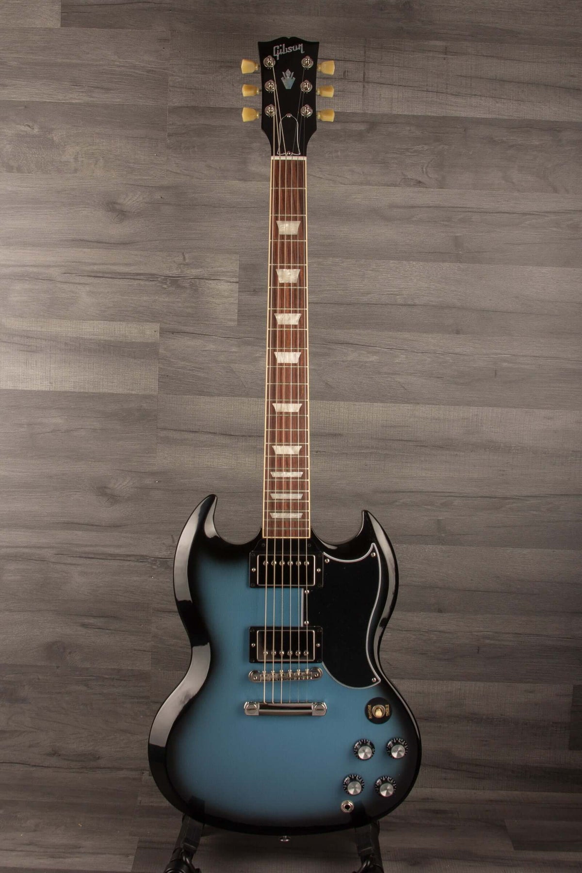 Gibson SG Standard '61 Stopbar Electric Guitar - Pelham Blue Burst displayed on a stand with a sleek design.