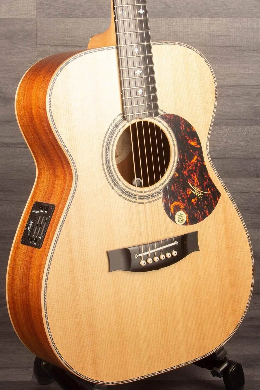 USED - Maton EBG808ART Artist - Acoustic Guitar showcased with stunning wood finish and clear soundhole design.