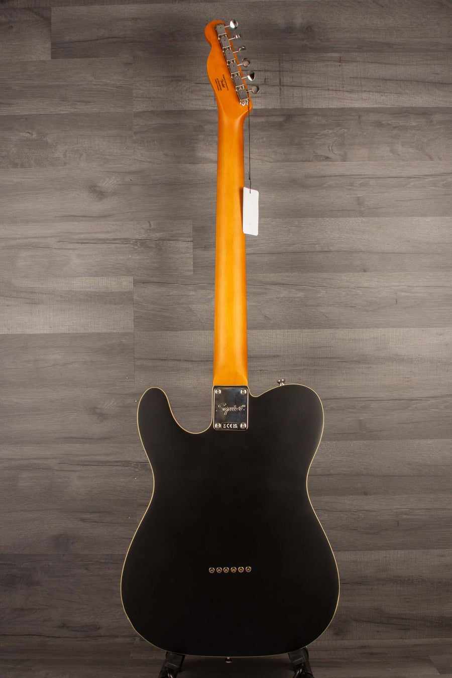 Back view of Squier Classic Vibe Baritone Custom Telecaster showcasing satin black finish and maple neck.