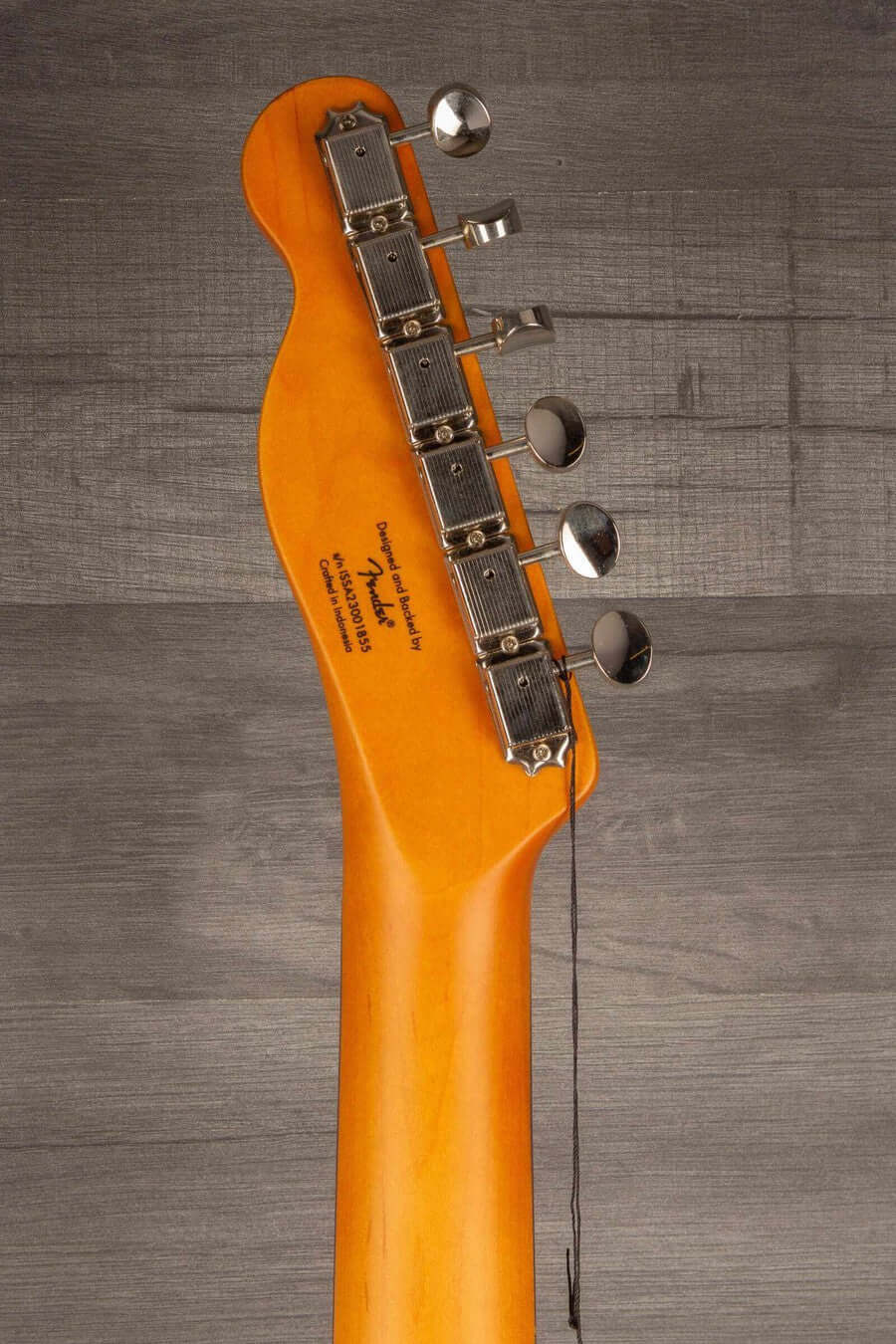 Back view of the Squier Classic Vibe Baritone Custom Telecaster neck with tuning pegs.