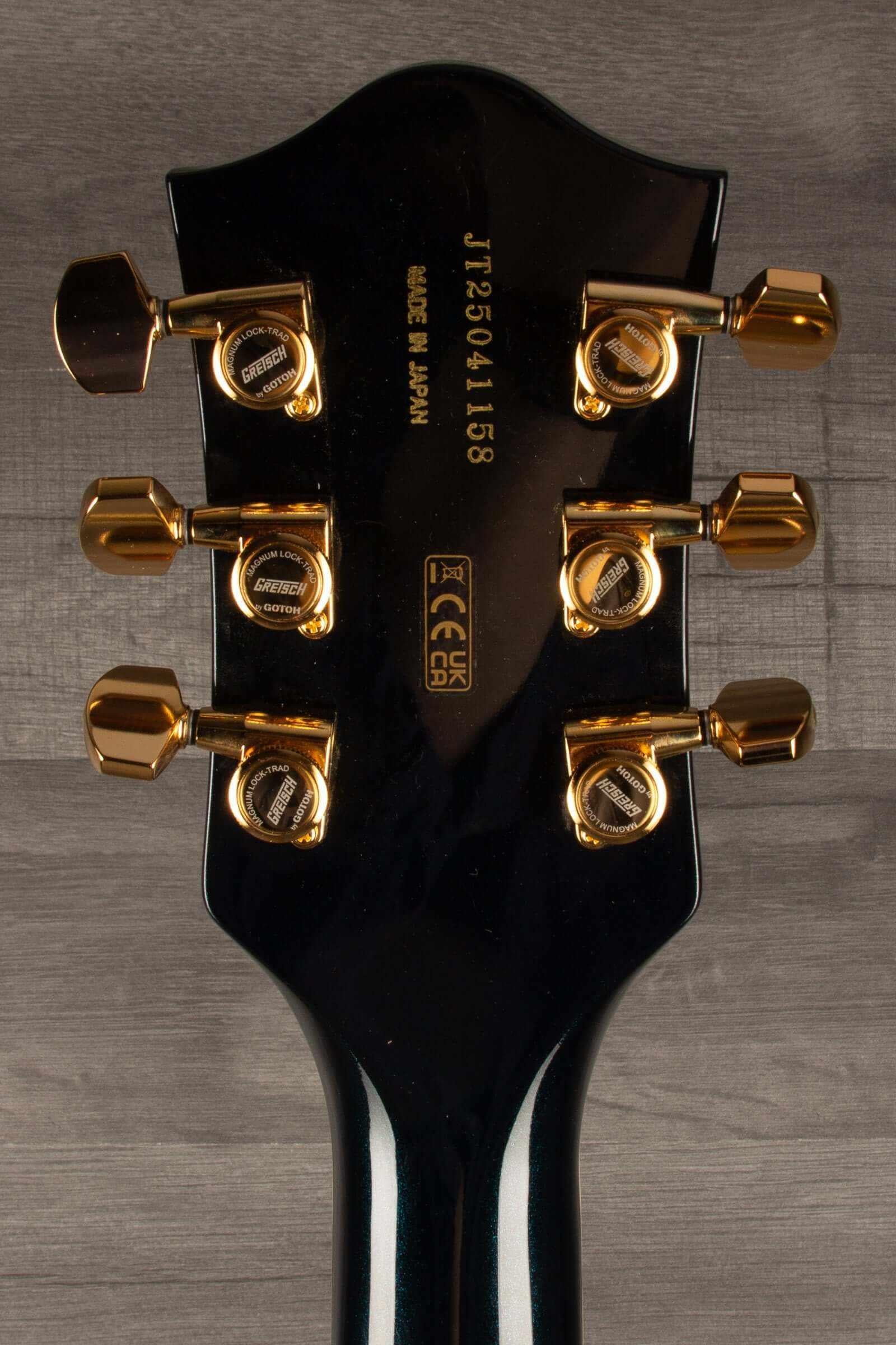 Gretsch Broadkaster® Jr. LX guitar headstock showing gold tuning pegs and serial number, made in Japan.