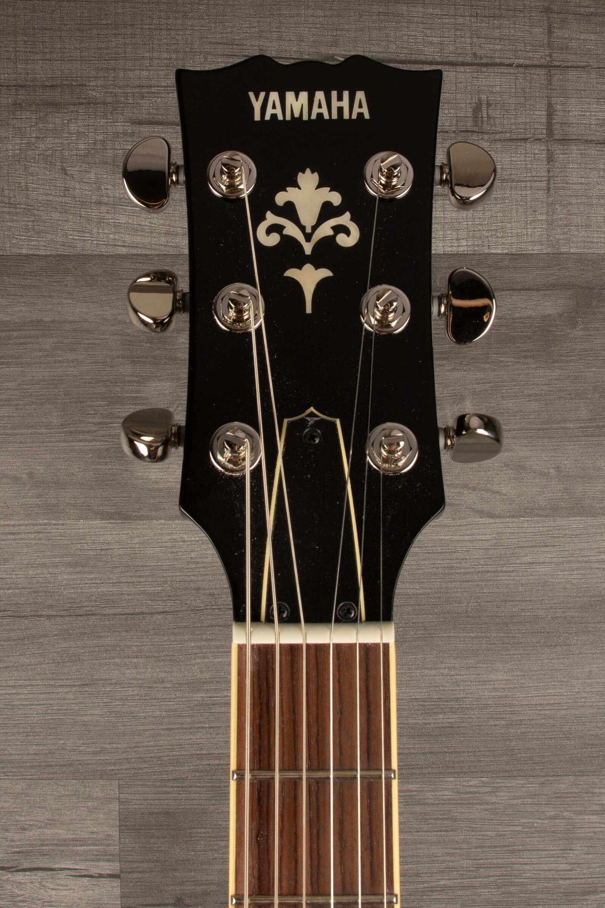 B-stock Yamaha SG1802 Black - Premium Electric Guitar headstock with elegant design and tuning pegs.