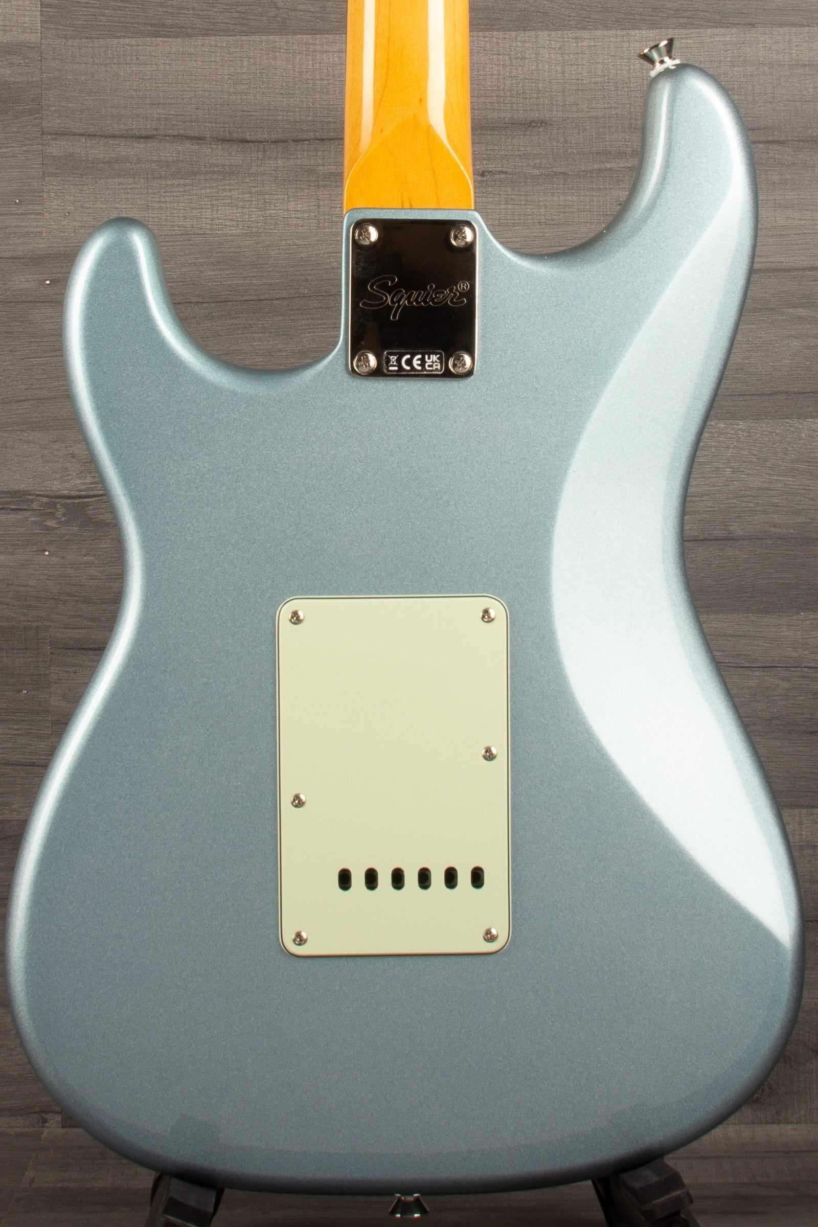 Back view of Squier FSR Classic Vibe 60s Stratocaster HSS in Ice Blue Metallic with mint pickguard.