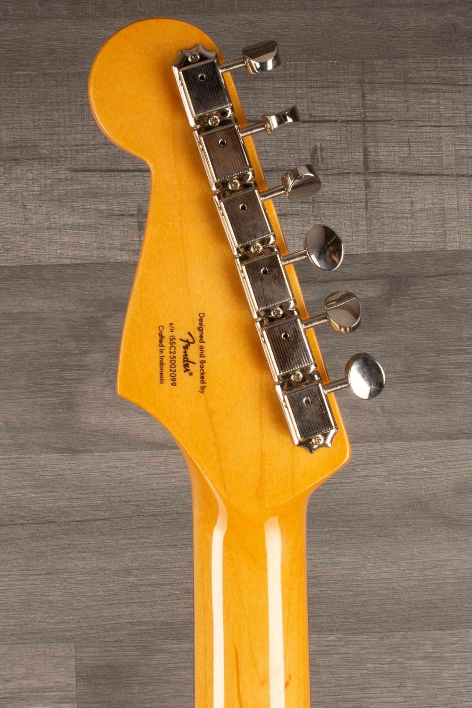 Squier FSR Classic Vibe 60s Stratocaster HSS headstock photo showing tuning pegs and neck detail.