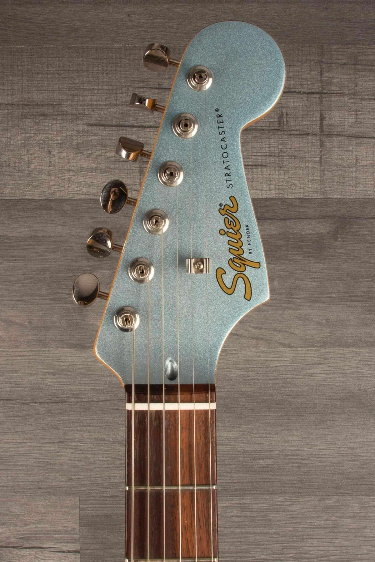 Close-up of Squier FSR Classic Vibe™ 60s Stratocaster® guitar neck and headstock in Ice Blue Metallic.