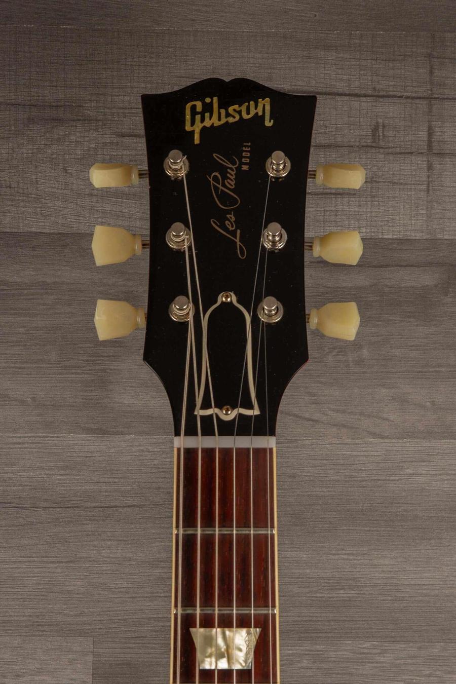 Gibson Les Paul guitar headstock with classic logo, tuners, and rosewood fingerboard.