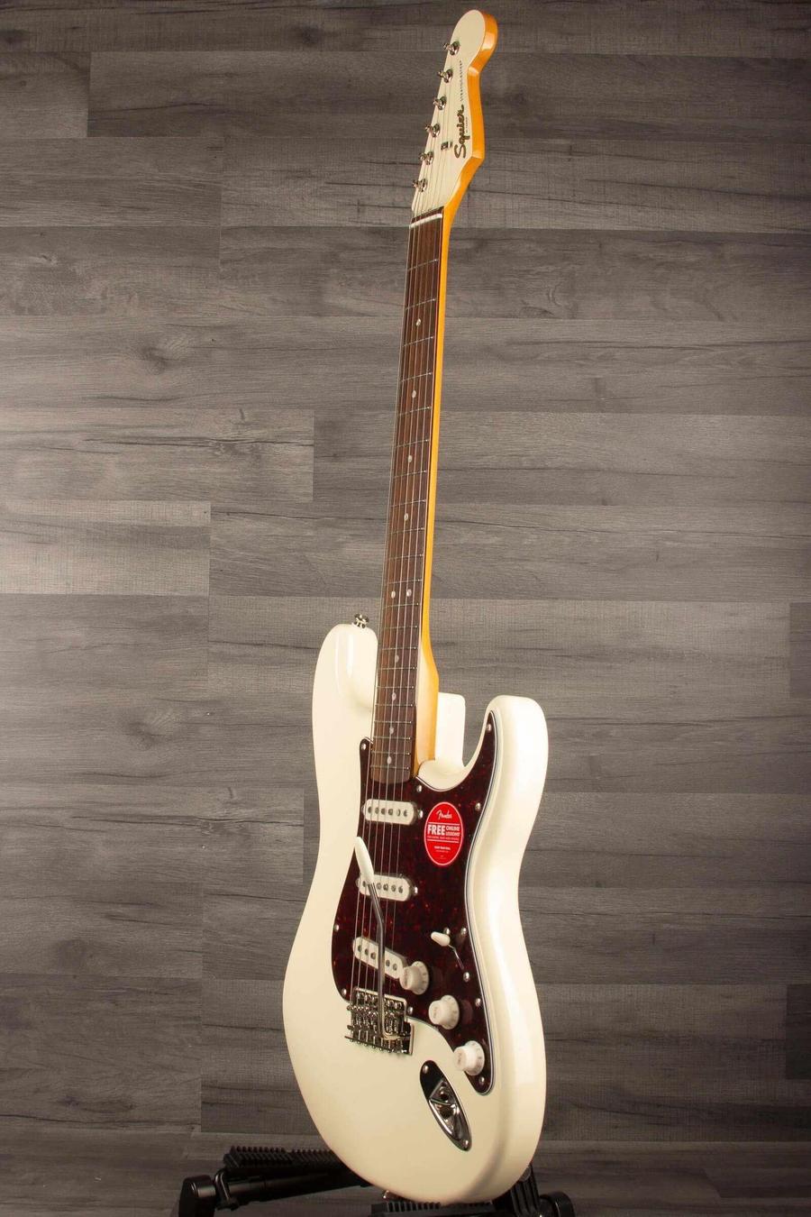 Squier FSR Classic Vibe '60s Stratocaster in Olympic white showcasing its alnico pickups and vintage design.