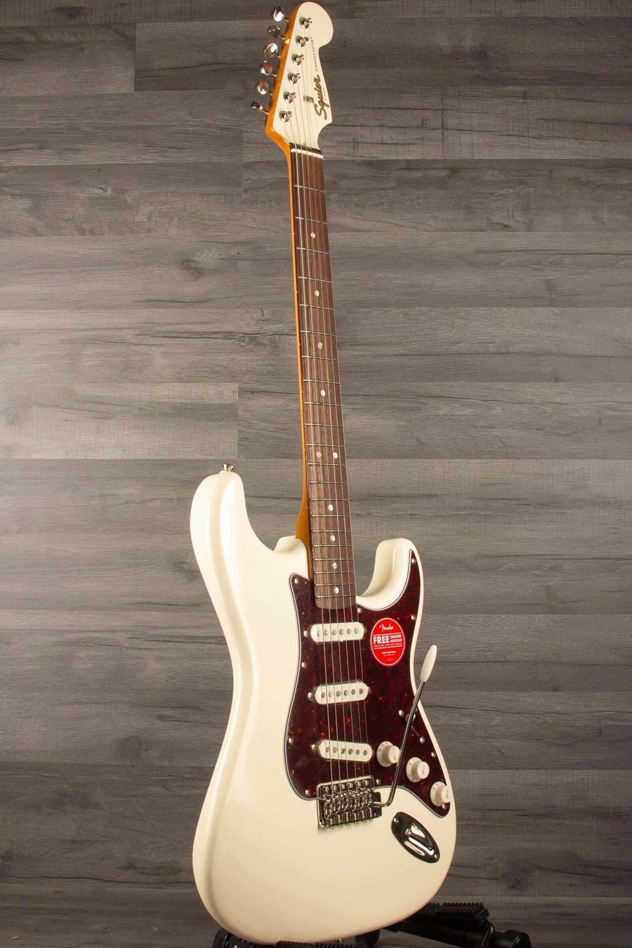 Squier FSR Classic Vibe '60s Stratocaster in Olympic white with alnico pickups and vintage-style tremolo.