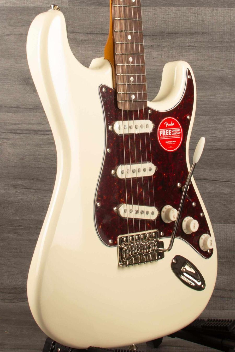 Squier FSR Classic Vibe '60s Stratocaster in Olympic white, featuring alnico pickups and vintage tremolo system.
