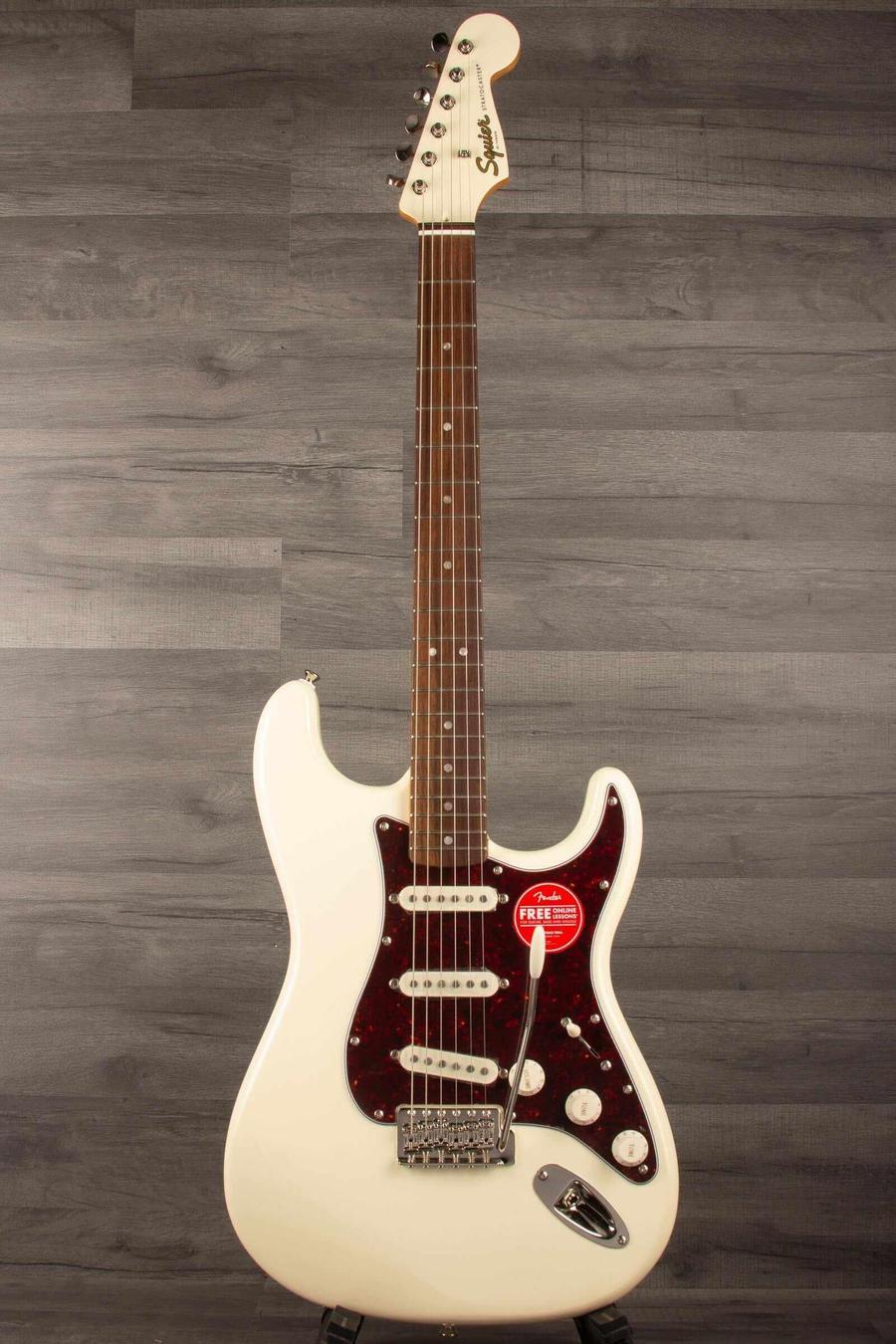 Squier FSR Classic Vibe '60s Stratocaster in Olympic white with three pickups and vintage tremolo system.