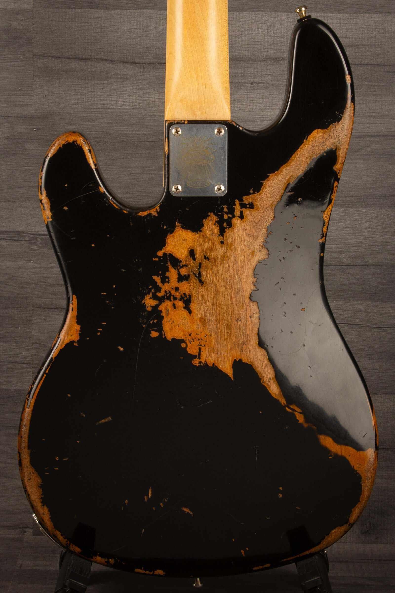 Duesenberg Chris Chaney Bass Black Distressed LTD back view showcasing unique wear and solid Alder body design.