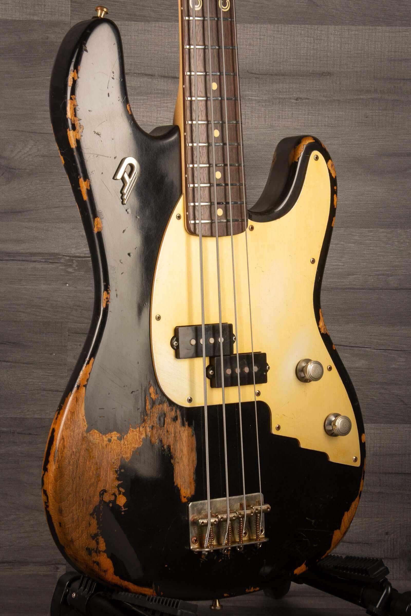 Duesenberg Chris Chaney Bass Black Distressed LTD showcasing its unique finish and features.