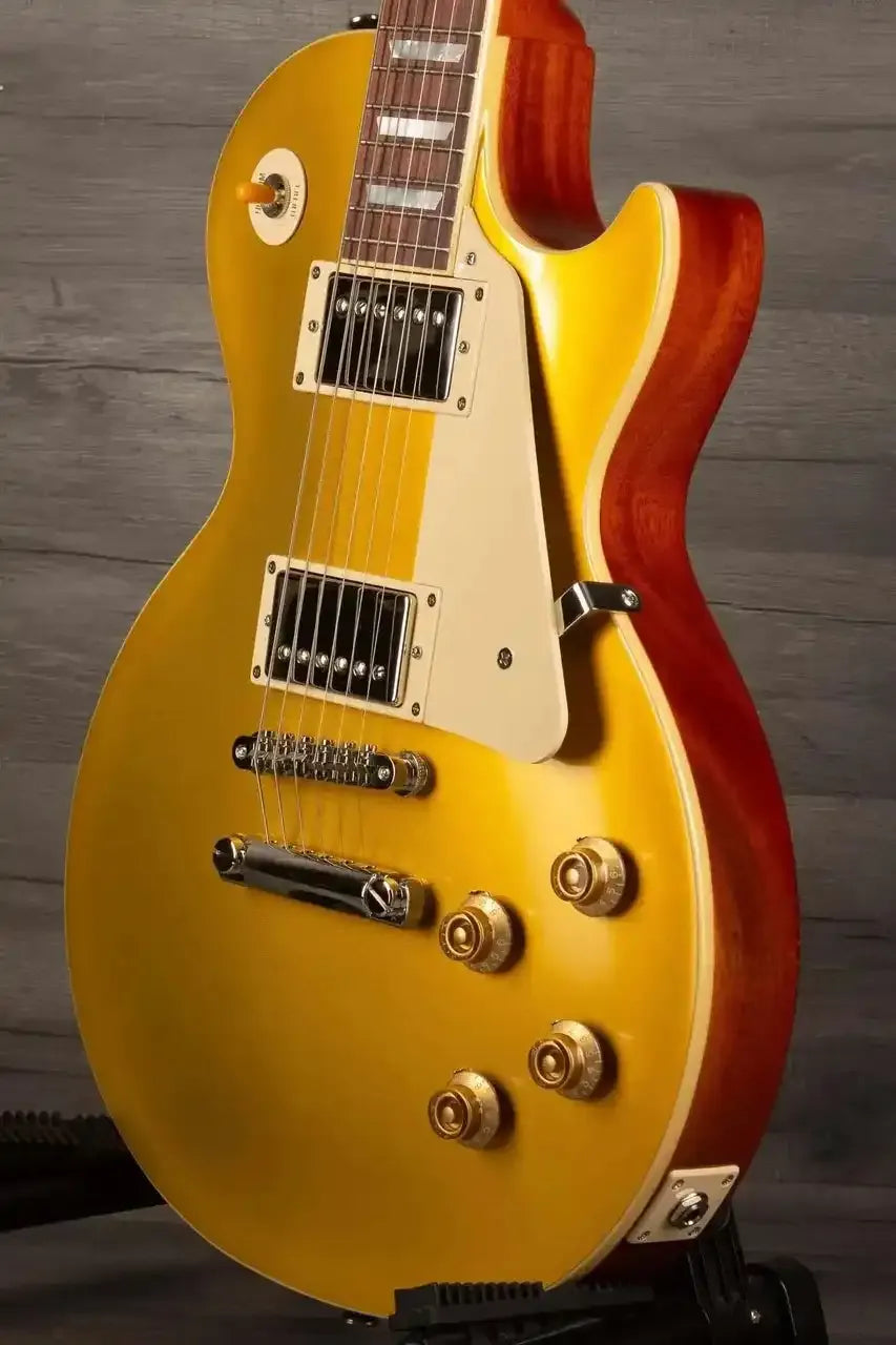 Close-up of Epiphone 1957 Les Paul Goldtop Reissue showcasing its gold finish and vintage design.