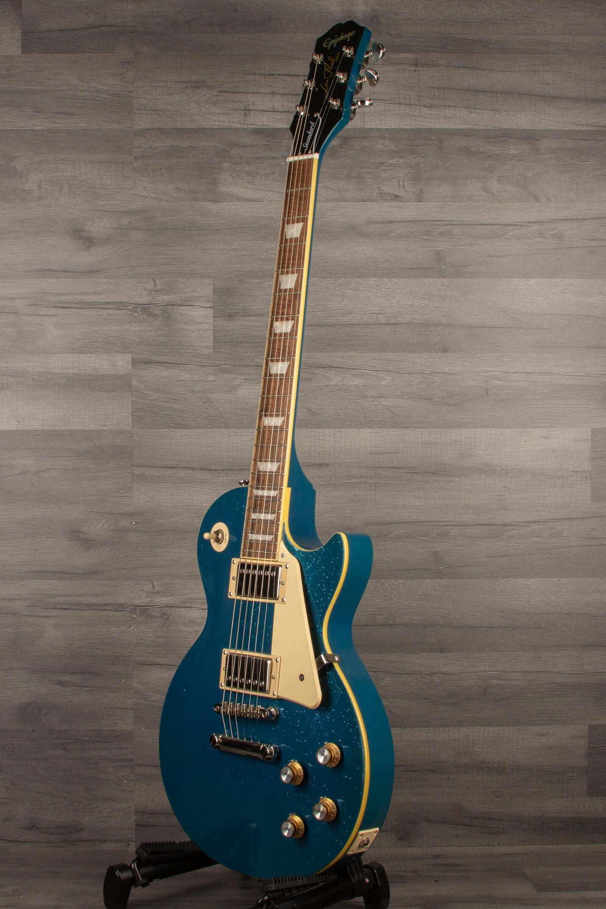 Epiphone Les Paul Standard 60's Brunswick Blue Sparkle electric guitar showcasing vibrant blue sparkle finish.