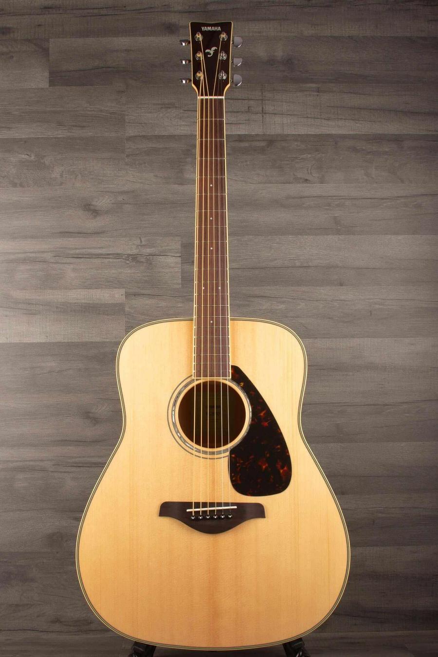 Yamaha FG840 Acoustic Guitar - Natural with superb scalloped bracing and classic design on wooden background.