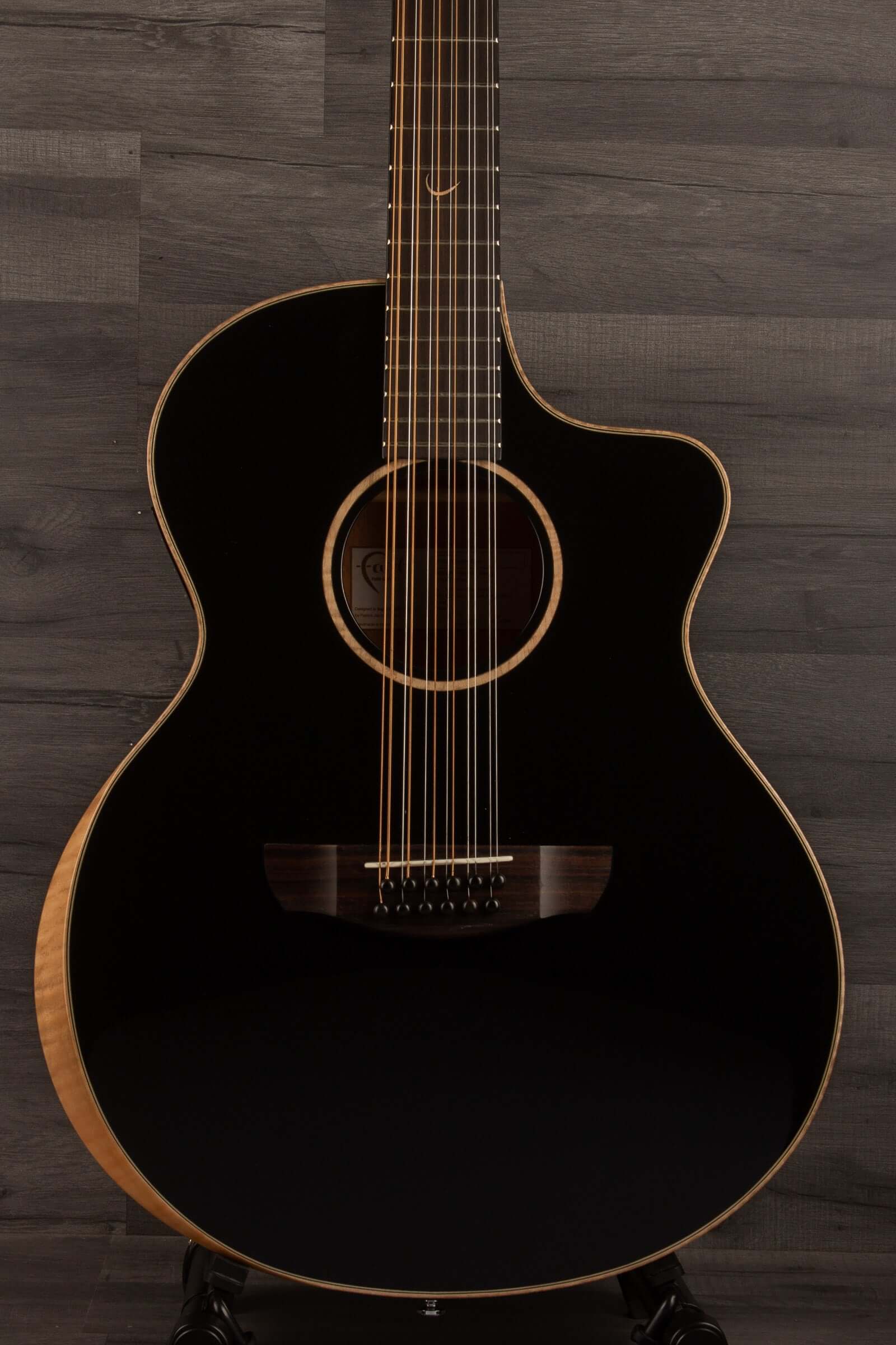 Faith ECLIPSE Series Neptune 12string CE Inc Case acoustic guitar close-up, showcasing elegant design and quality craftsmanship.