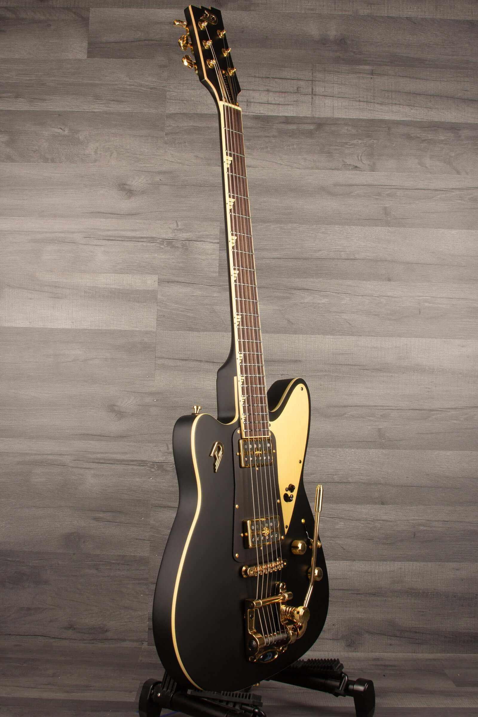Duesenberg Falken Tremola , Electric Guitar - Matte Black in a stylish side view against a neutral background.