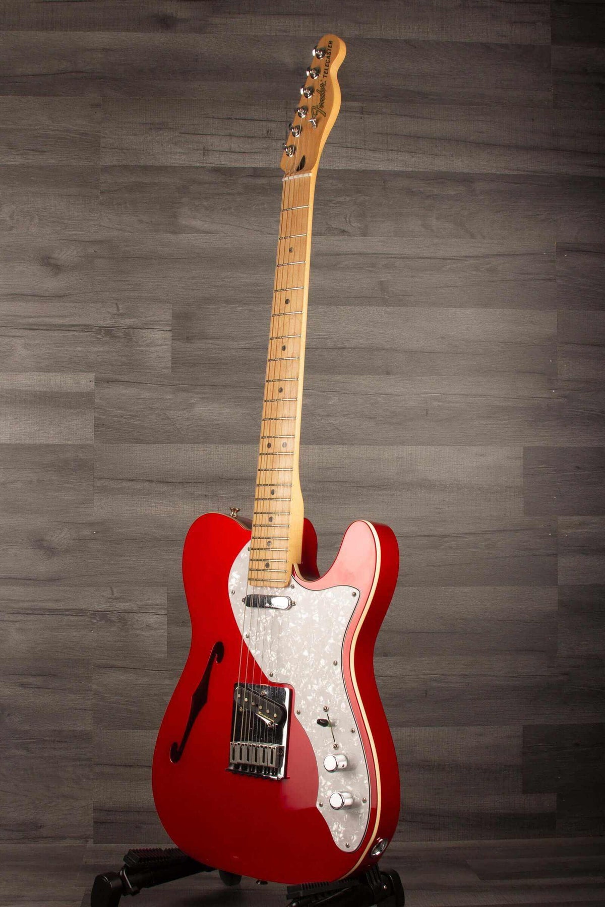 USED - Fender Deluxe Telecaster Thinline, Maple Fingerboard, Candy Apple Red on display with elegant design.
