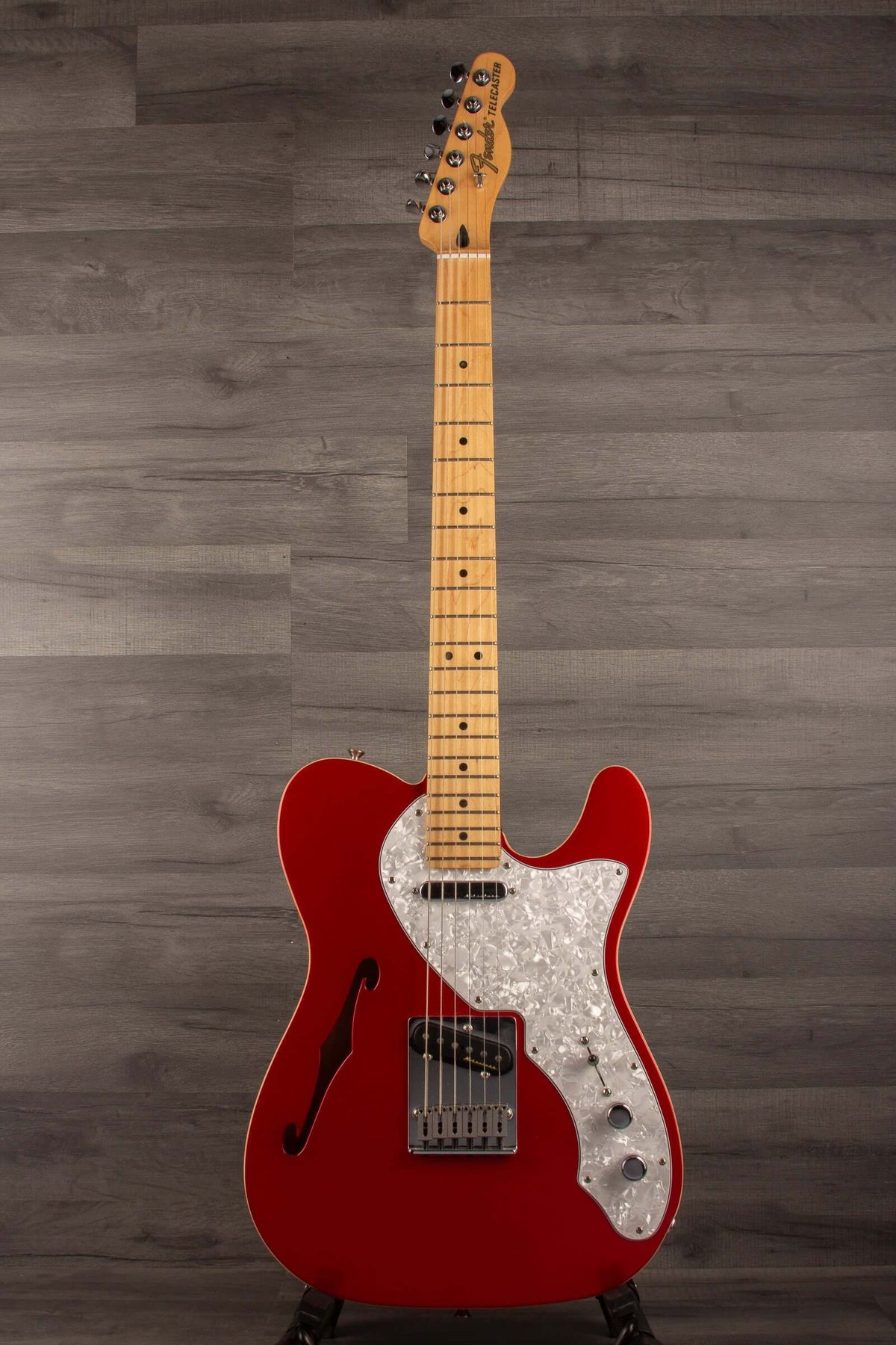 USED - Fender Deluxe Telecaster Thinline, Maple Fingerboard, Candy Apple Red on display with a stylish finish.
