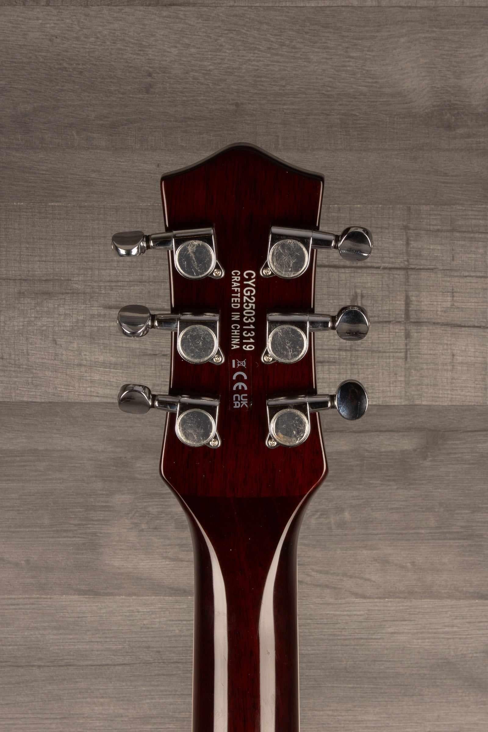 Back view of Gretsch G5230T Electromatic® Sparkle Jet™ guitar neck with tuning pegs.
