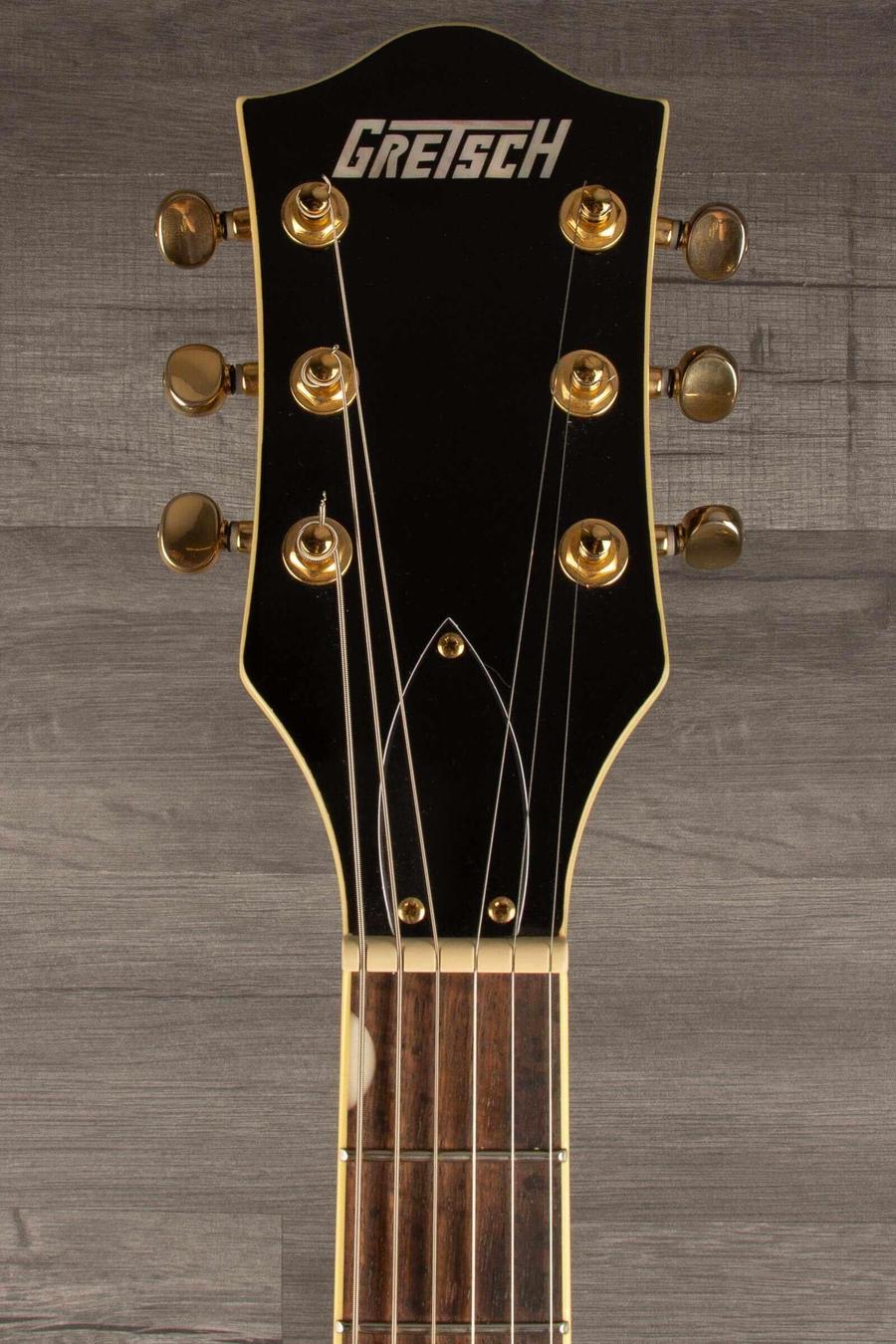 Gretsch G5655TG Electromatic Center Block Jr. guitar headstock with gold hardware, showcasing the classic Gretsch logo.