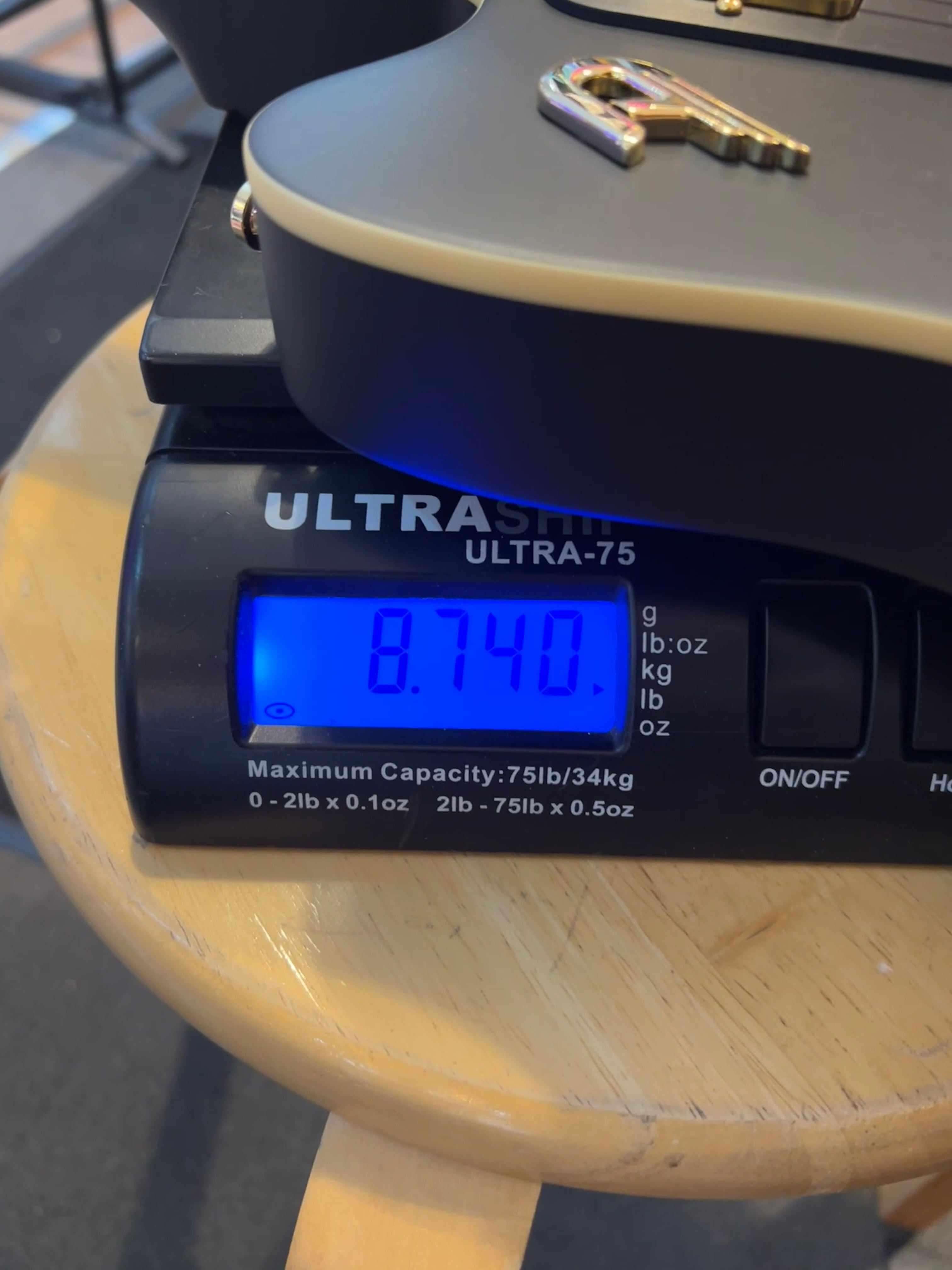 Duesenberg Falken Tremola , Electric Guitar - Matte Black weighing 8.740 lbs on a digital scale.