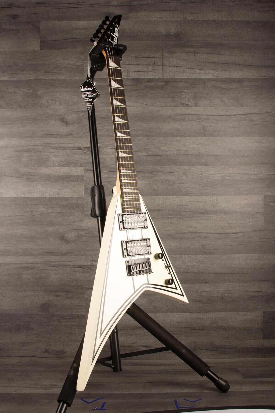 Jackson JS Series RR JS1XM Minion Electric Guitar - Snow White with black hardware and Jackson pointed 6-in-line headstock.