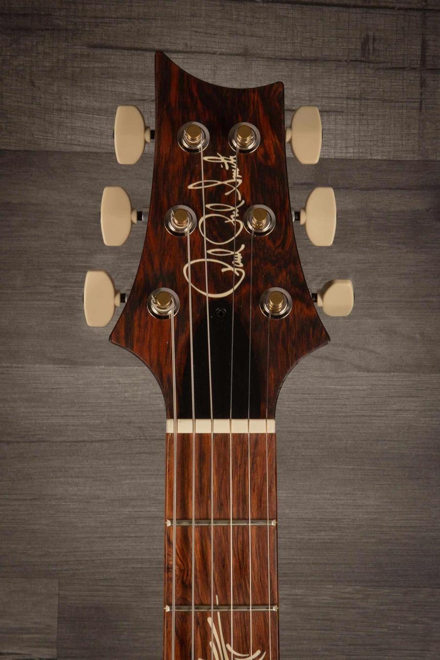 Close-up of the headstock of the USED - PRS Paul's Guitar Dark Cherry Sunburst featuring intricate inlays and tuning pegs.