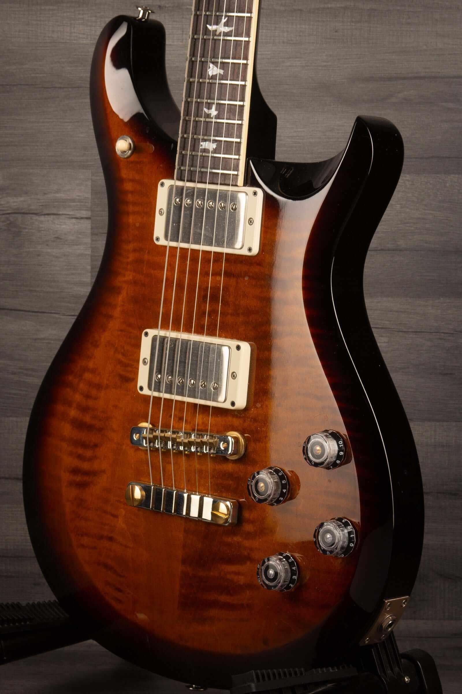 USED - PRS S2 McCarty 594 10th anniversary guitar showcasing a beautiful mahogany body and custom controls.