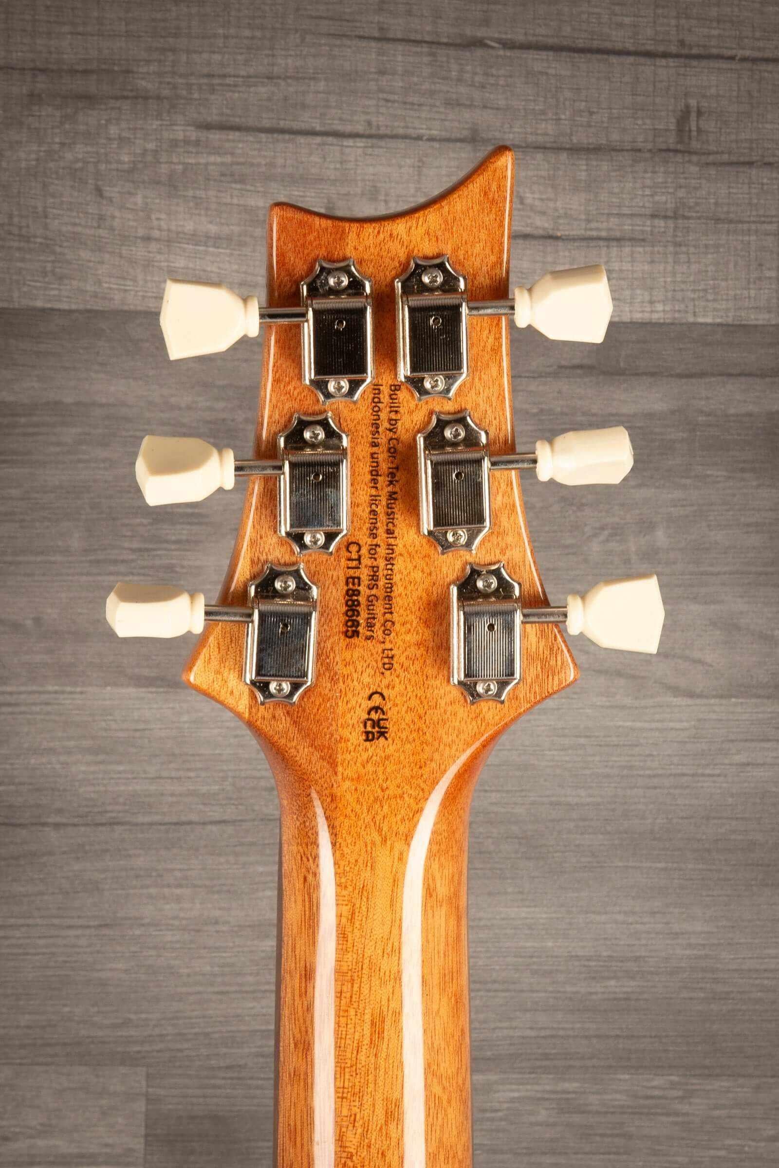 USED - PRS SE Paul’s Guitar Electric Guitar - Faded Blue Burst headstock view with tuning pegs.