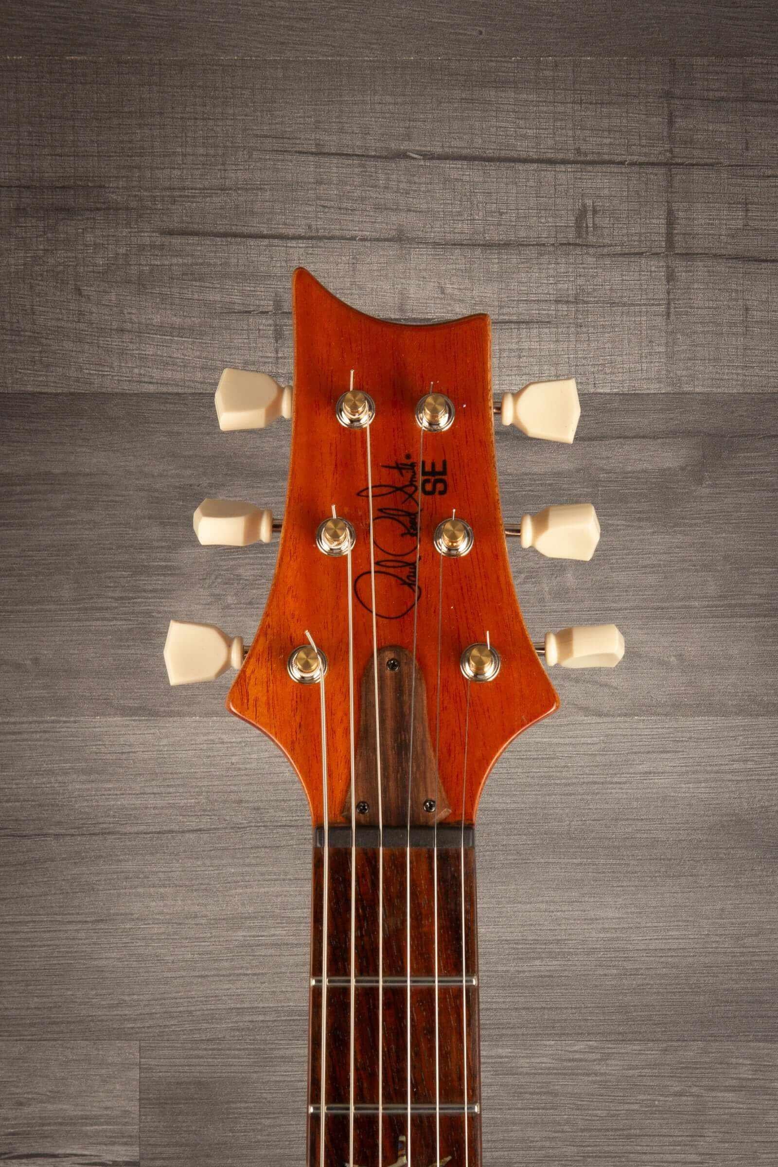 USED - PRS SE Paul’s Guitar Electric Guitar - Faded Blue Burst headstock with tuning pegs and signature.