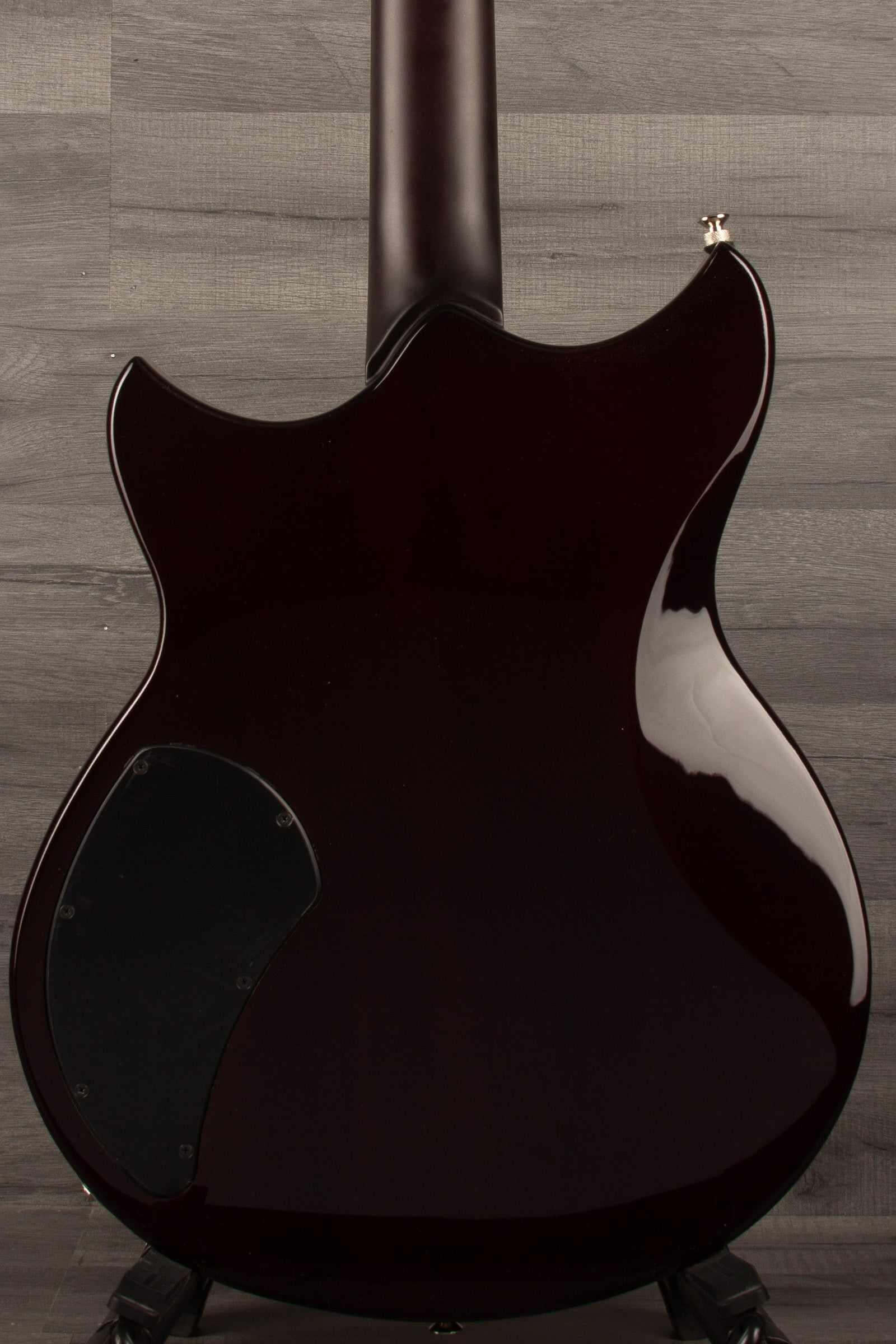 Yamaha RSS02T Revstar - Fire Red guitar back view showcasing the unique body design and glossy finish.