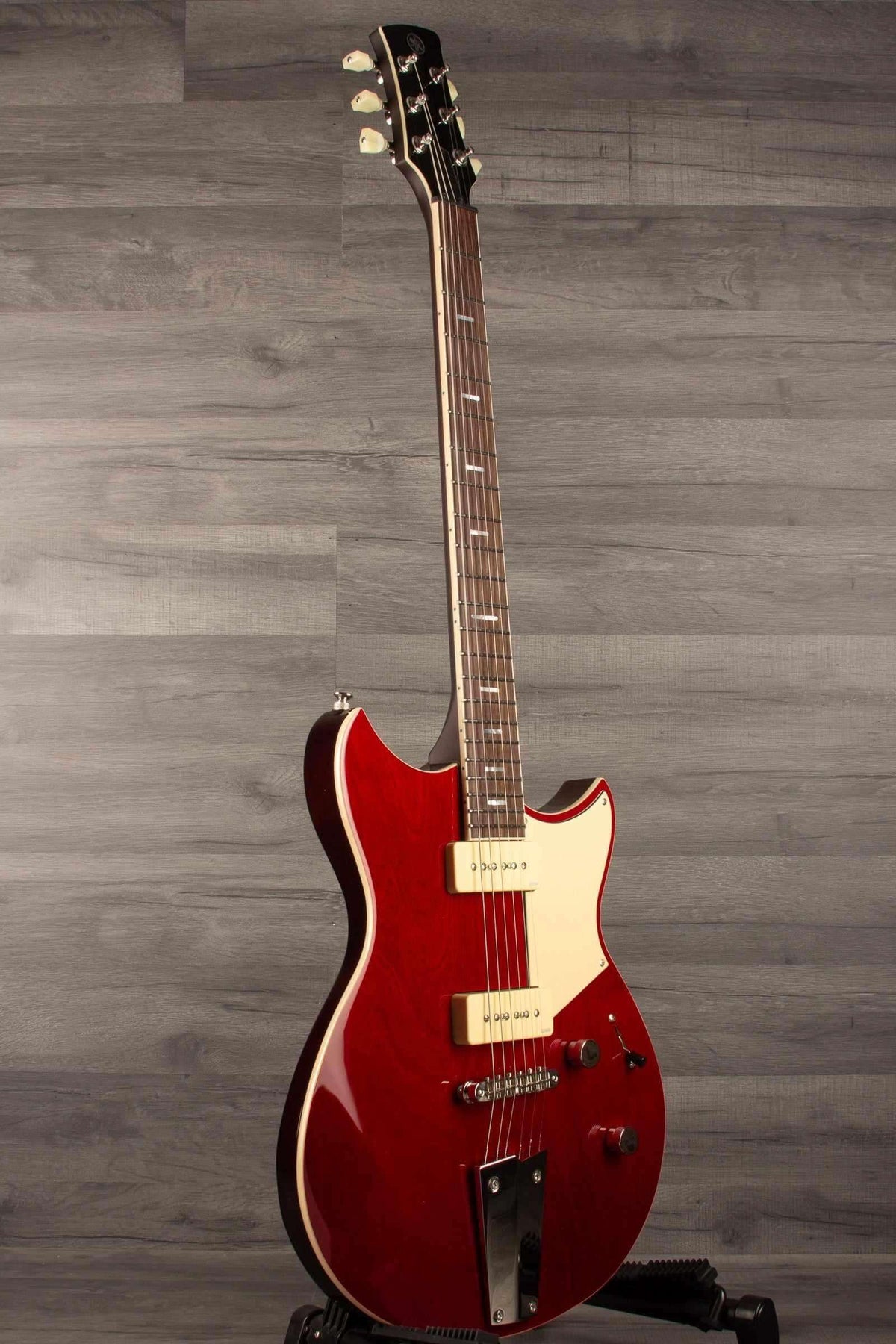 Yamaha RSS02T Revstar - Fire Red electric guitar with custom tailpiece and P90 pickups.