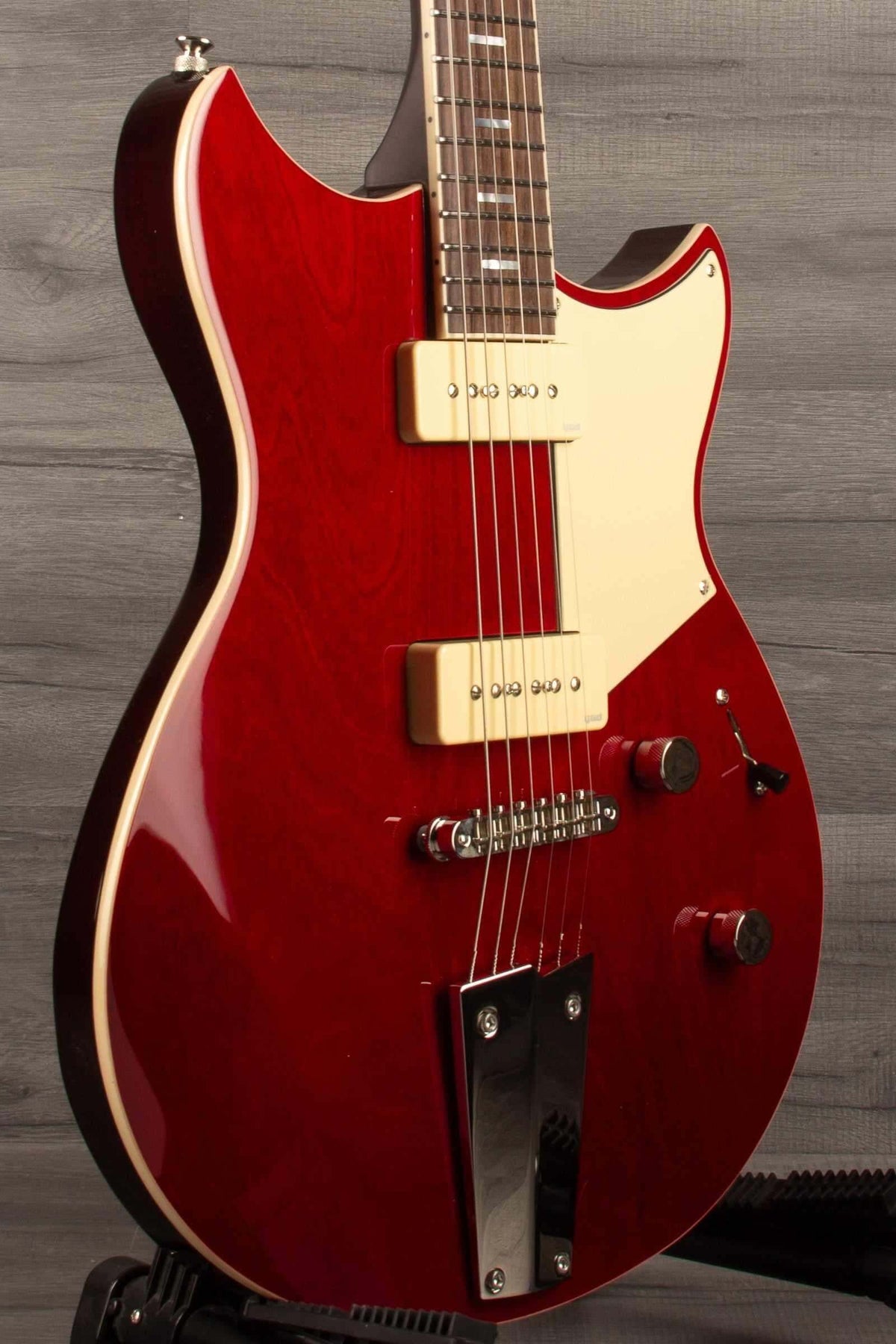 Yamaha RSS02T Revstar - Fire Red electric guitar showcasing custom tailpiece and P90 pickups.