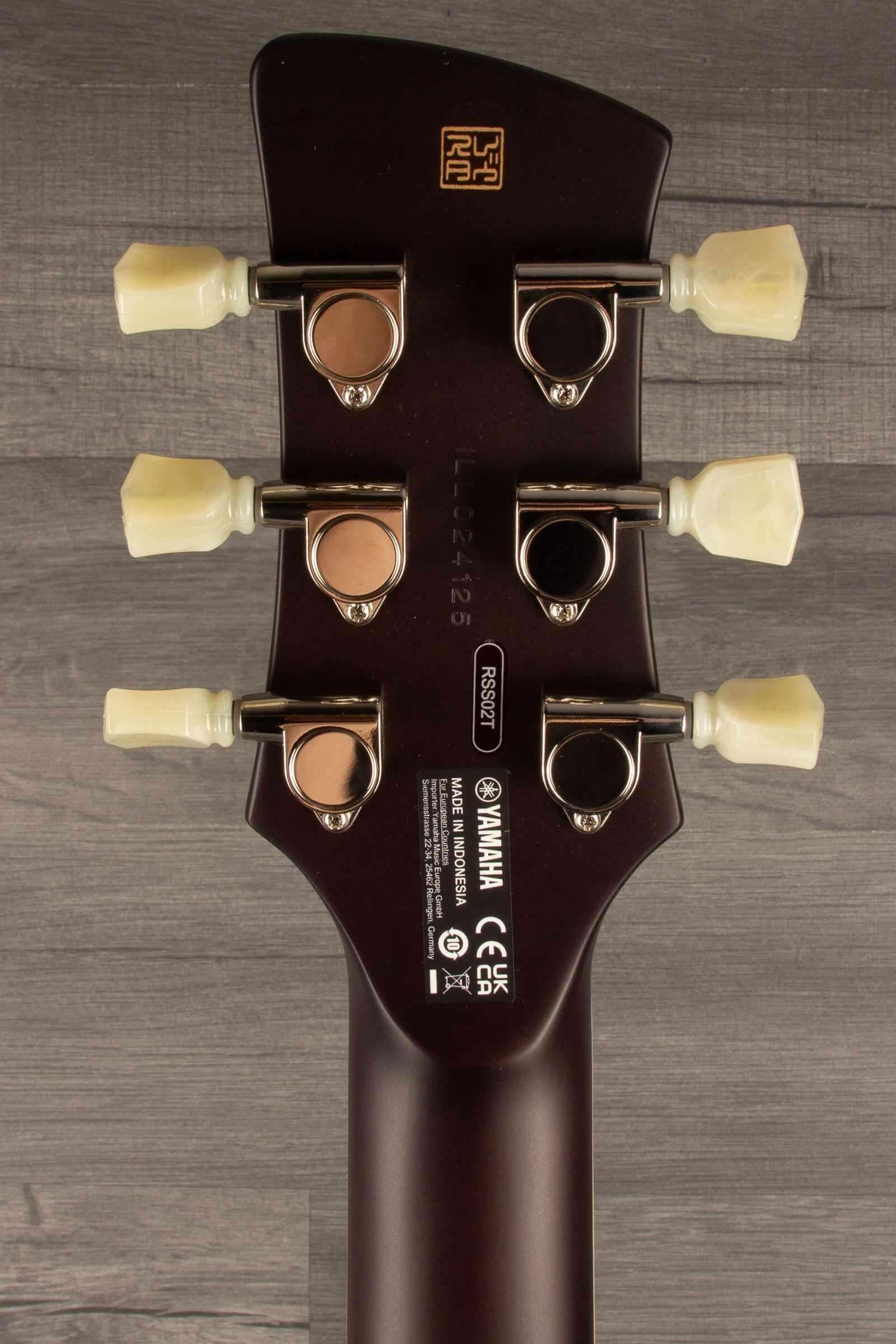 Yamaha RSS02T Revstar - Vintage White guitar headstock with tuning pegs and brand markings.