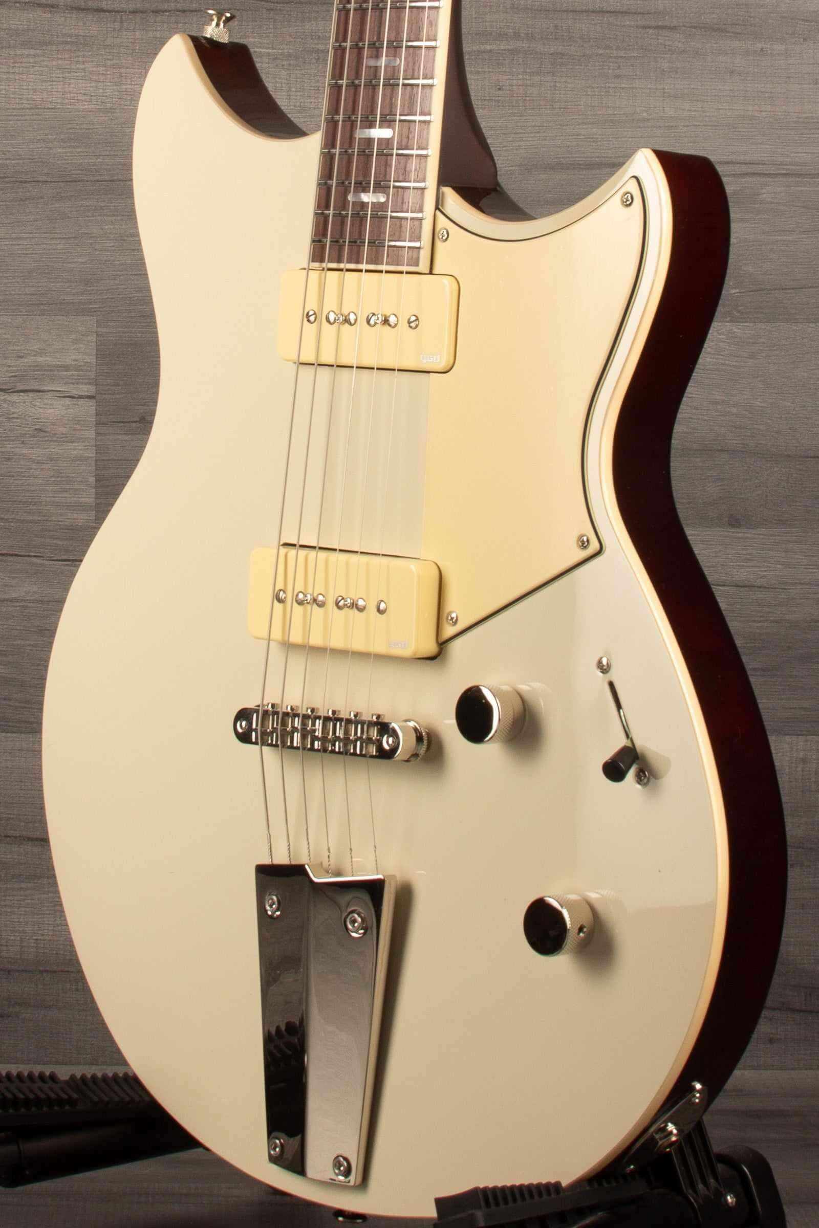 Yamaha RSS02T Revstar - Vintage White guitar showcasing custom tailpiece and P90 pickups.