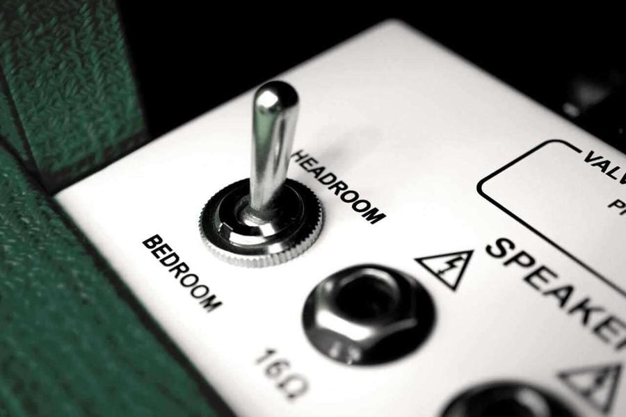 Close-up of the switch and knobs on the Orange Ltd edition- Rocker 15 1x10 Guitar Combo british racing green.