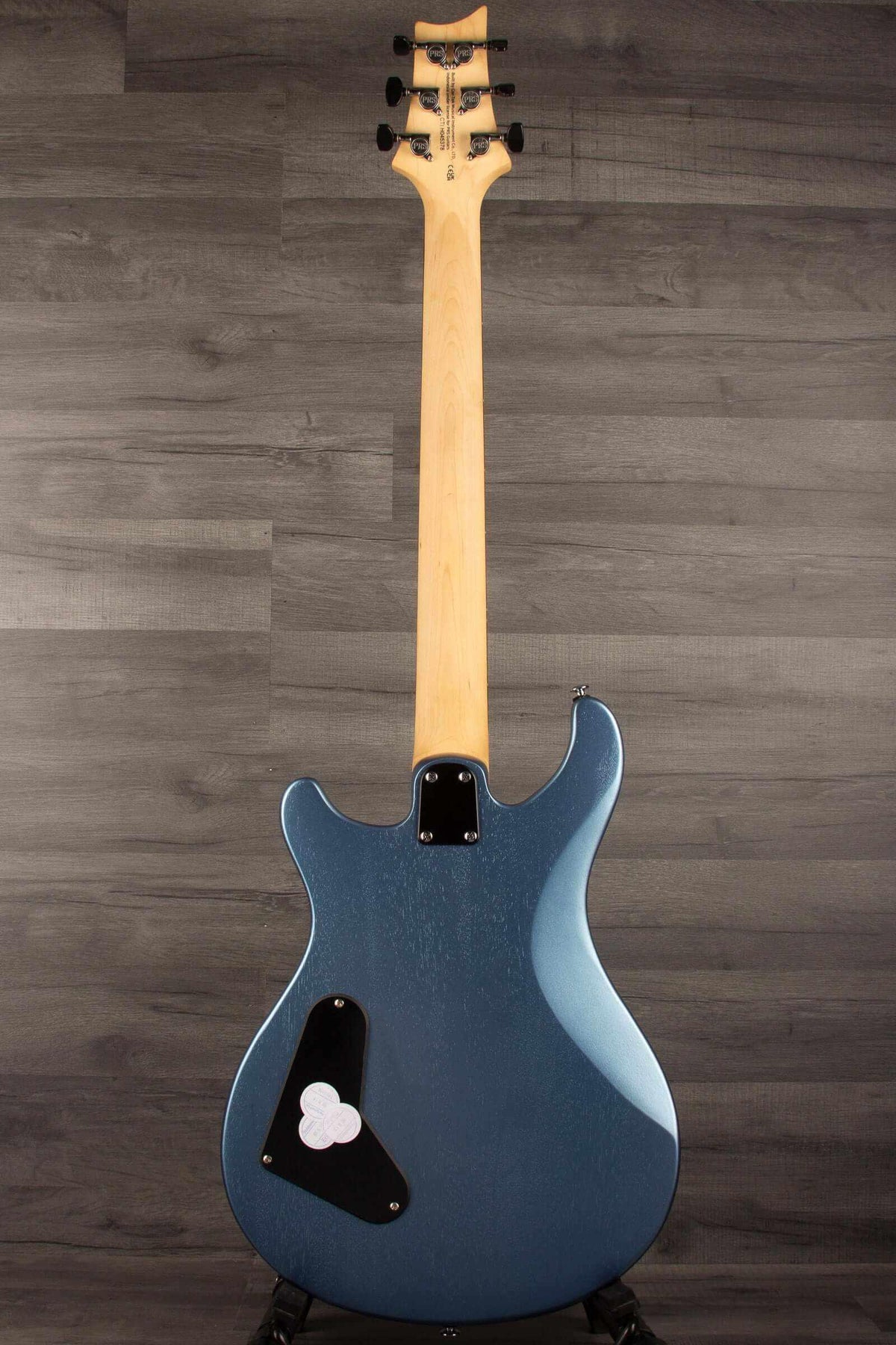 Back view of the PRS SE CE24 Standard Stoptail in Ice Blue Metallic, showcasing its all-mahogany body and unique finish.