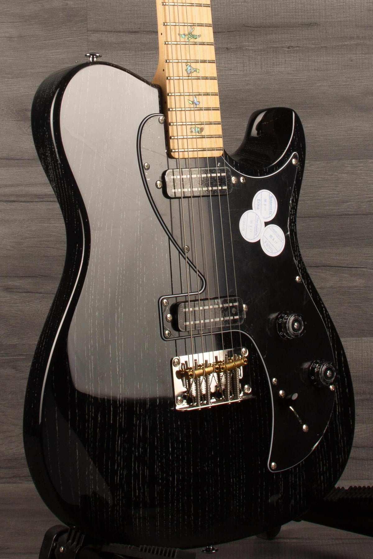PRS SE NF53 Electric Guitar, Black Doghair Finish showcasing a sleek black design with distinctive pickups.