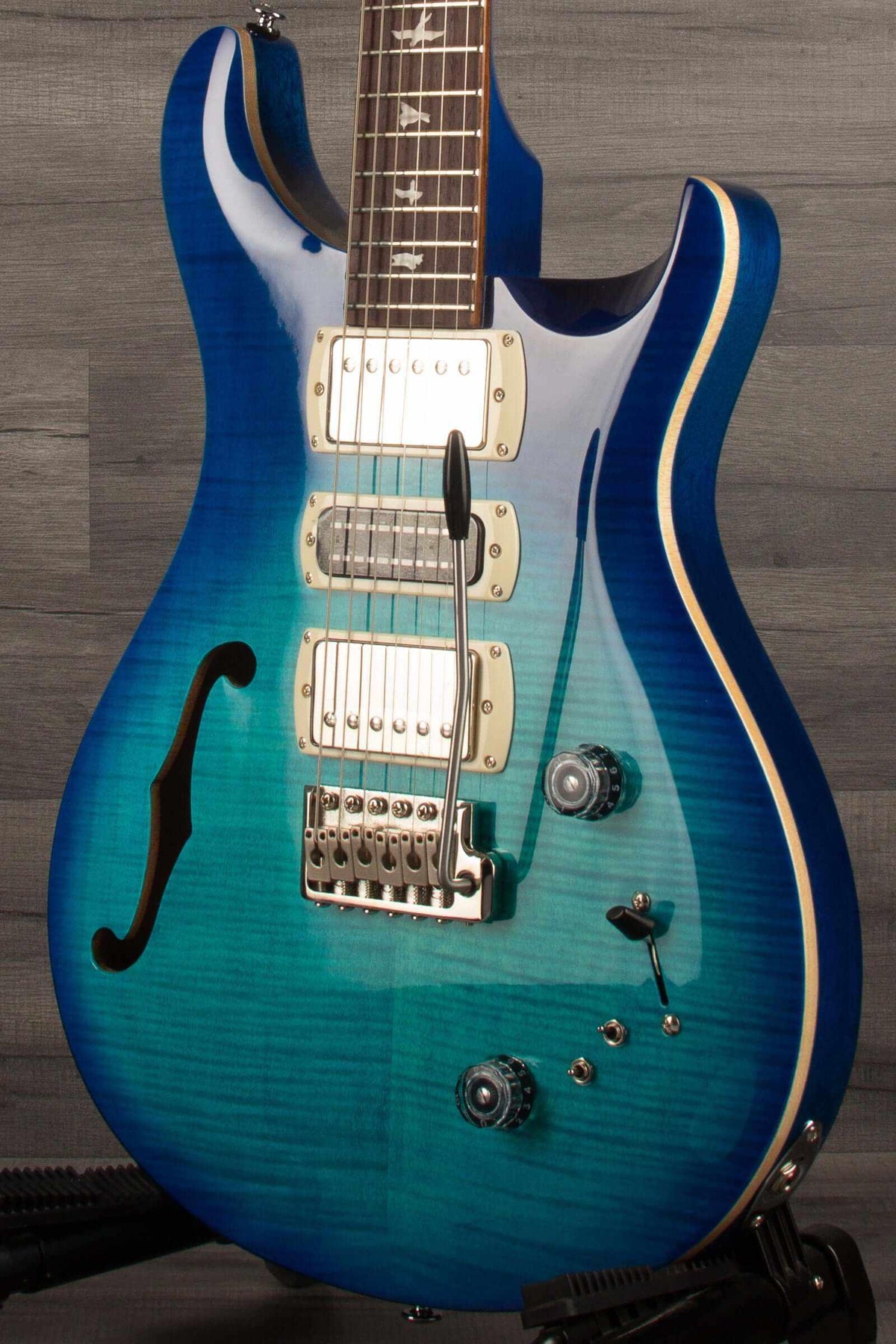 PRS SE Special Semi Hollow - Lake Blue electric guitar showcasing its semi-hollow body and vibrant blue finish.