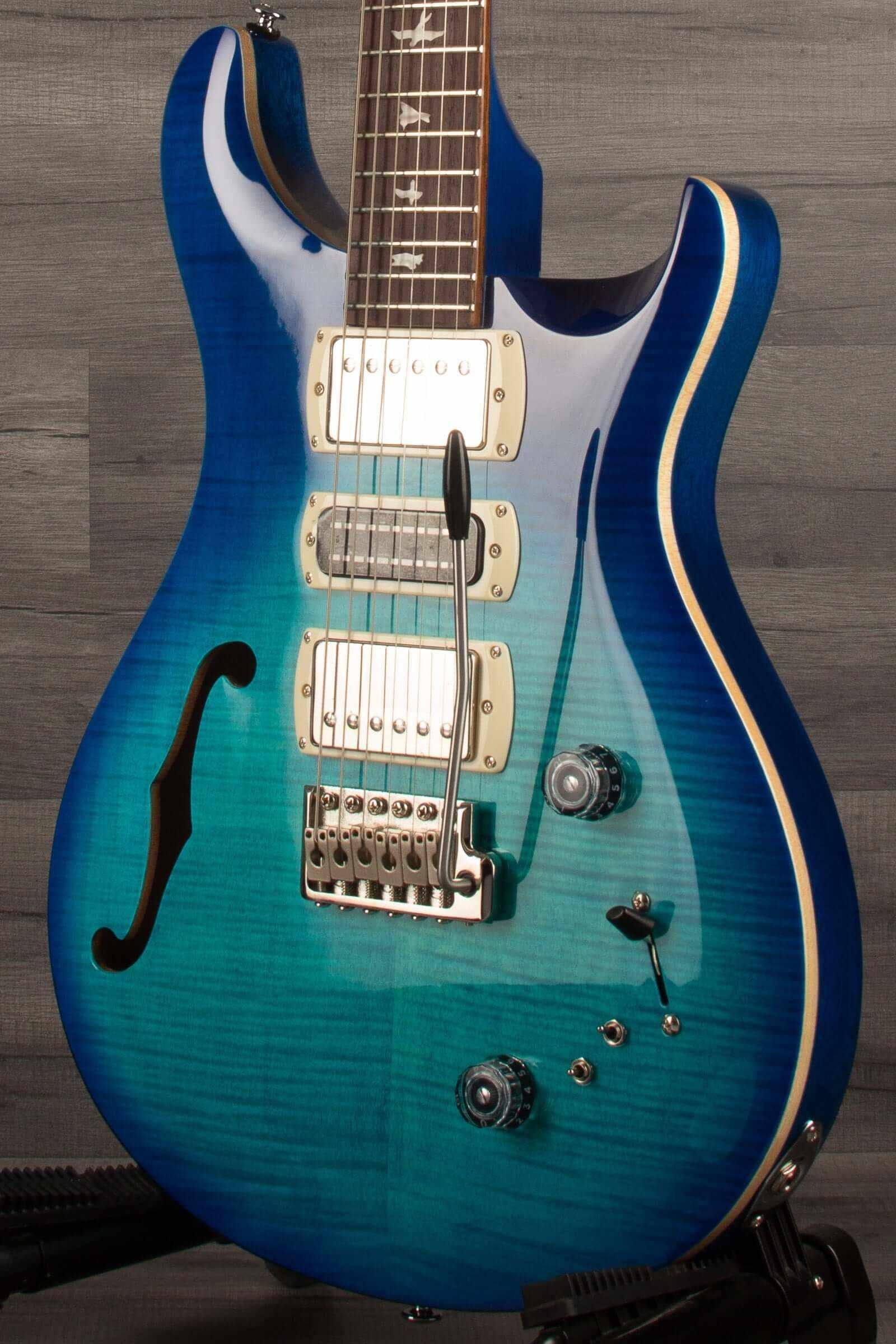 PRS SE Special Semi Hollow - Lake Blue electric guitar showcasing its semi-hollow body and vibrant blue finish.