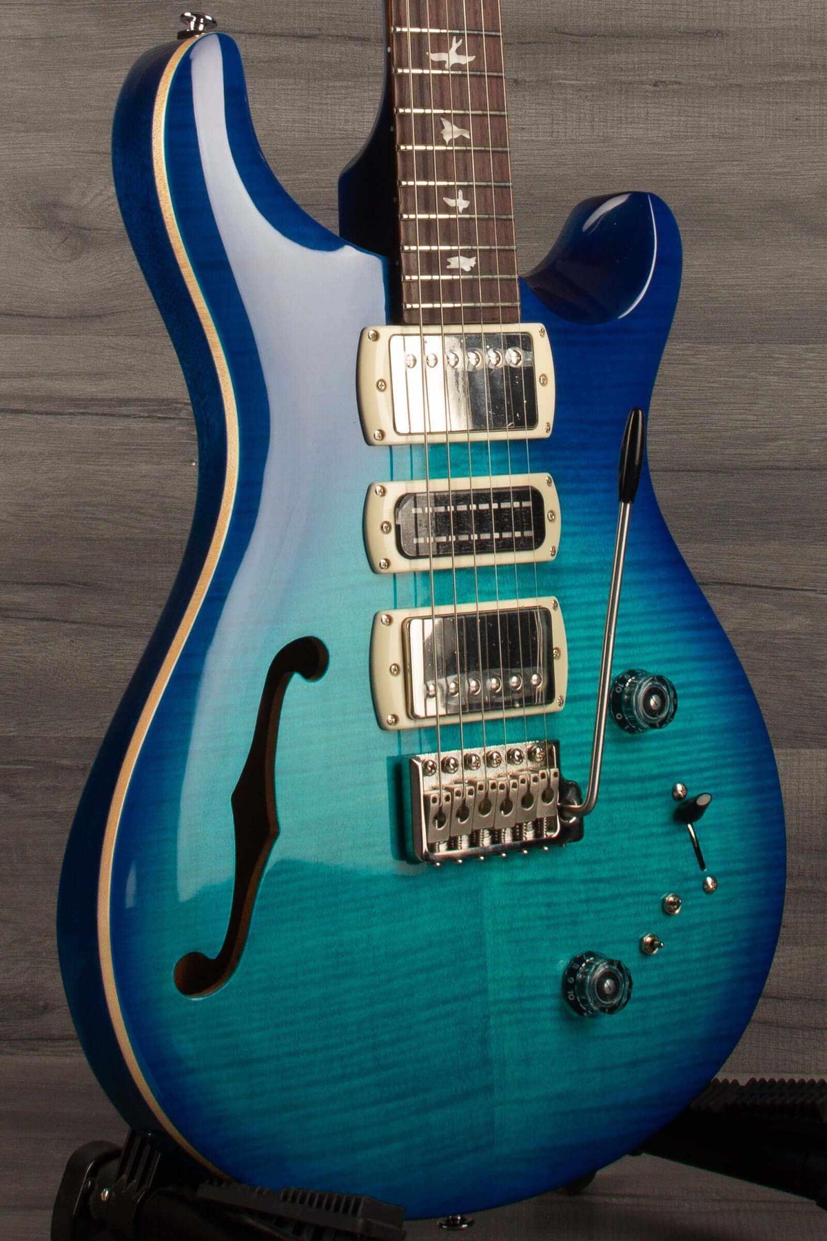 PRS SE Special Semi Hollow - Lake Blue guitar showcasing its semi-hollow body and stunning blue finish.
