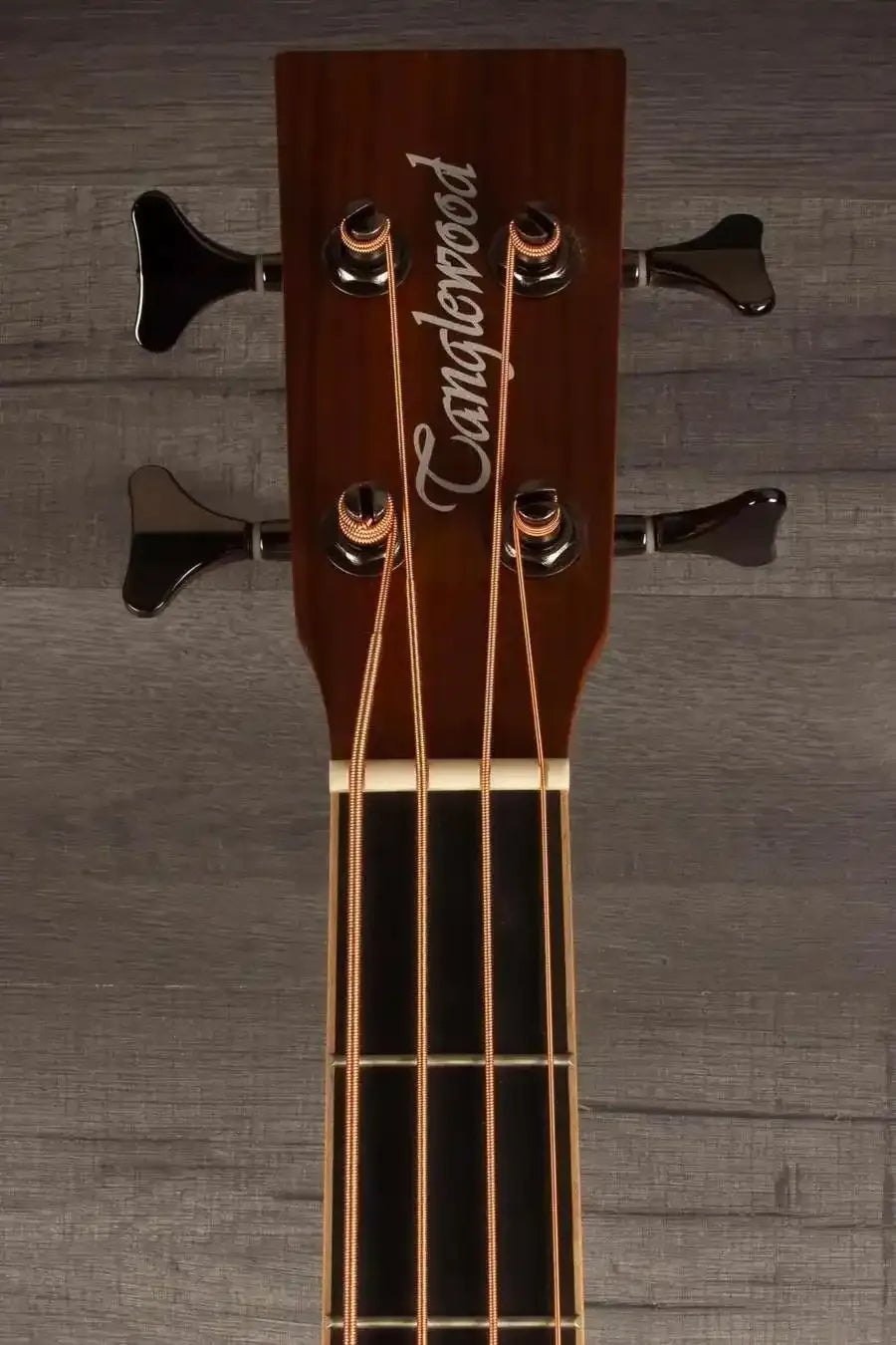 Tanglewood TRPROABBW Acoustic - Bass Guitar headstock featuring tuning pegs and logo.