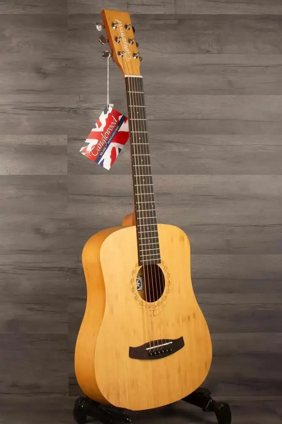 Tanglewood TWT18 Tiare Travel Acoustic, Natural Bamboo guitar displayed against a wooden background.