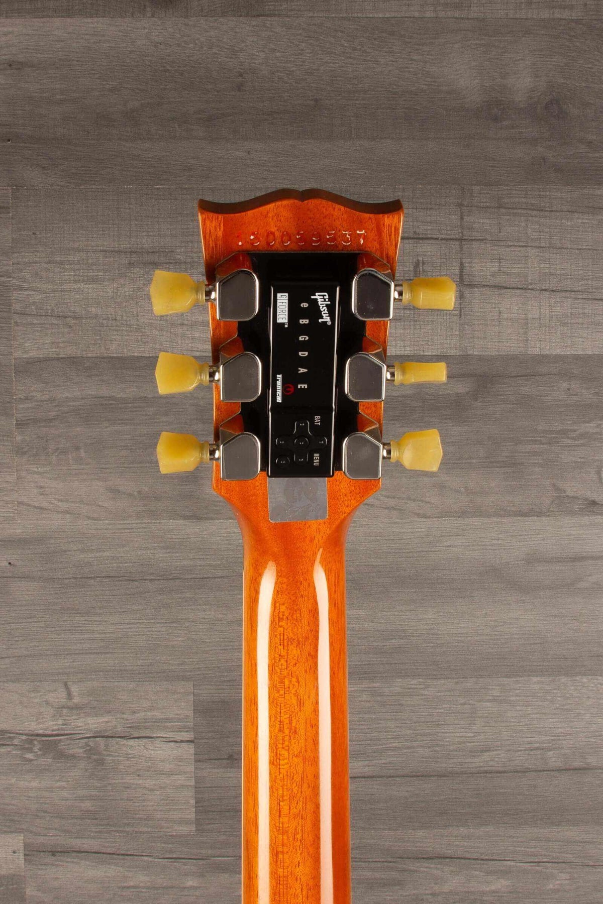 Top view of a used Gibson 2015 Les Paul Deluxe Gold Top guitar neck with G FORCE tuning system.