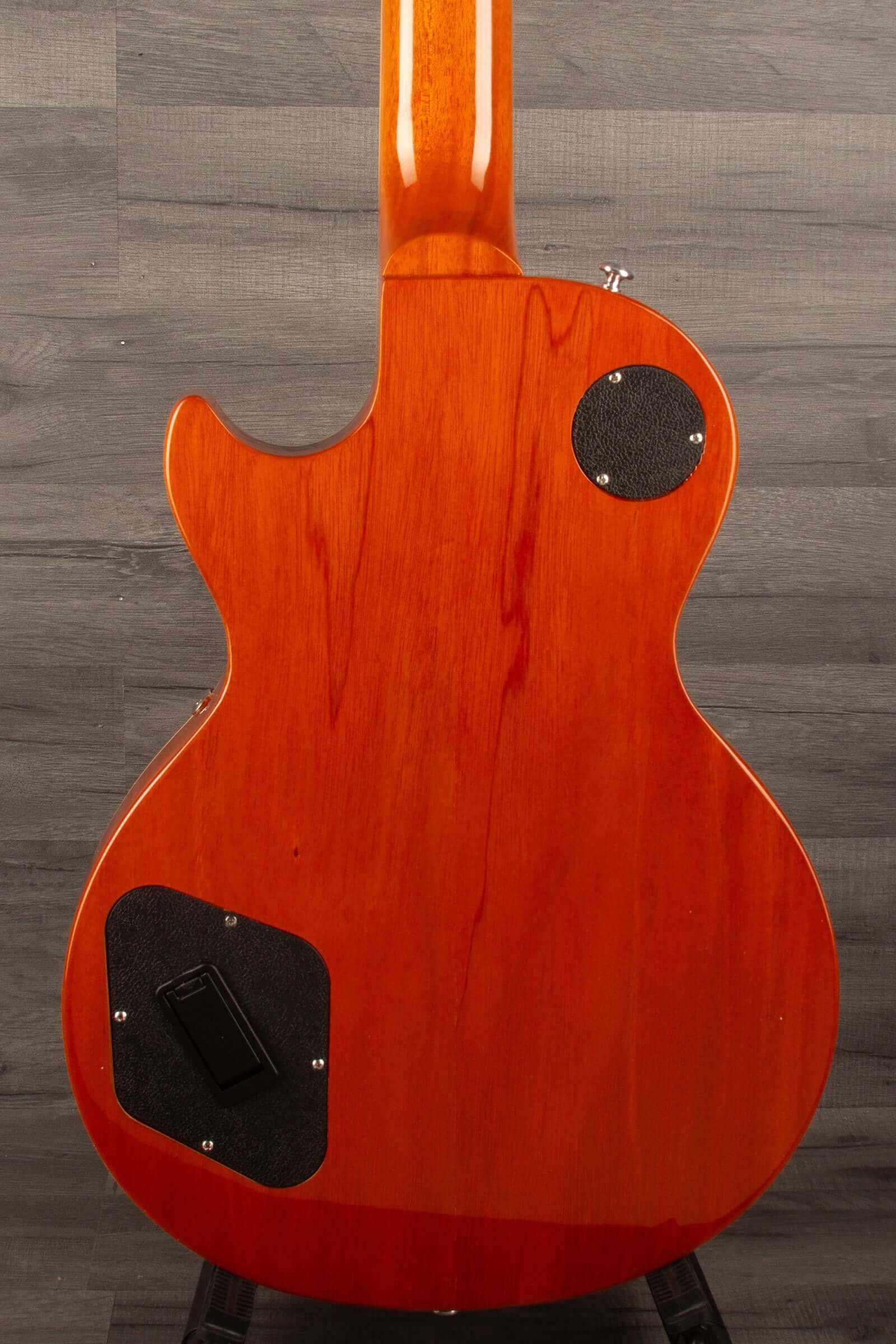 Back view of a USED Gibson 2015 Les Paul Deluxe Gold top guitar showcasing its beautiful wood finish.