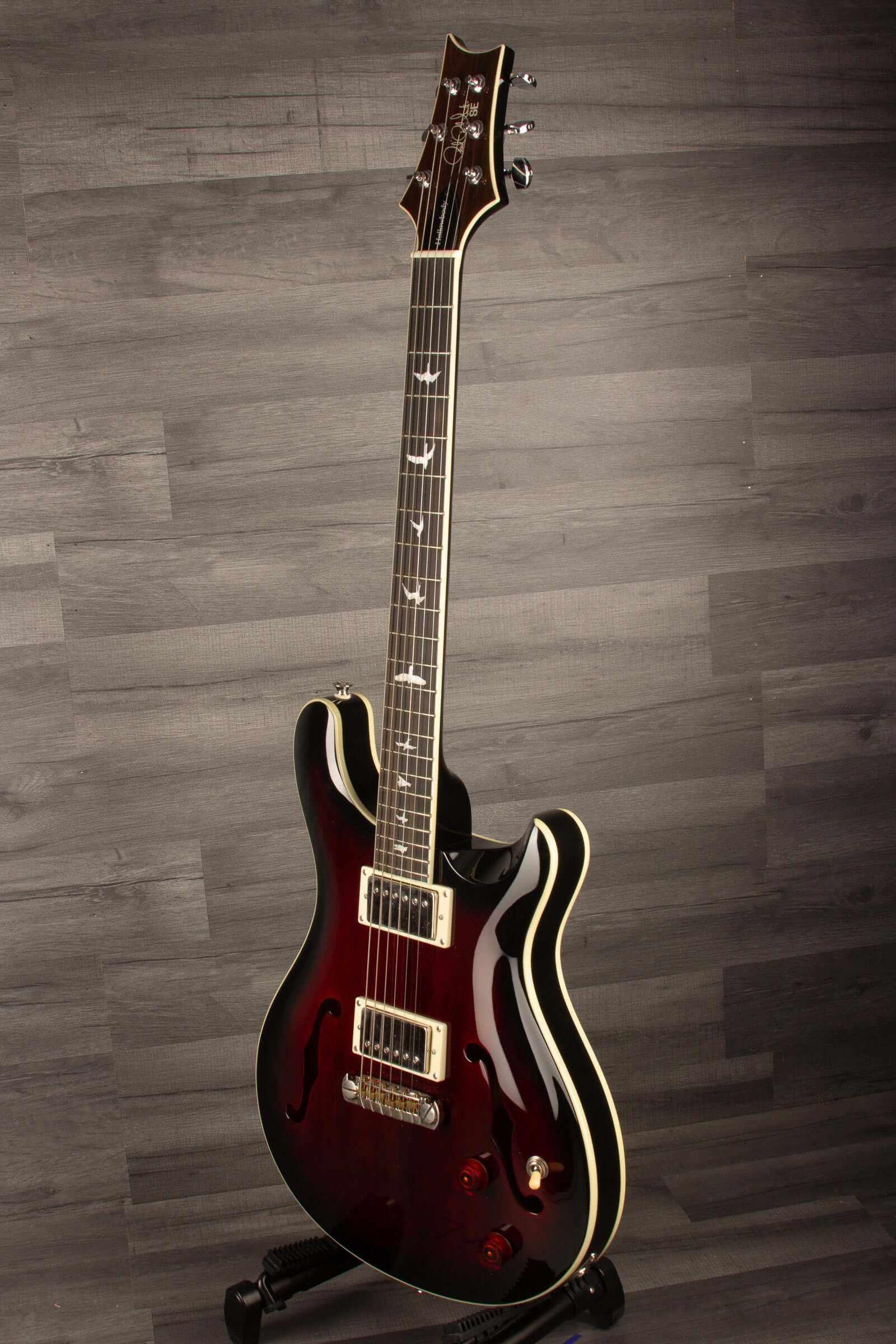 USED PRS SE Hollowbody Standard Fire Red Burst guitar showcasing its mahogany body and elegant design.