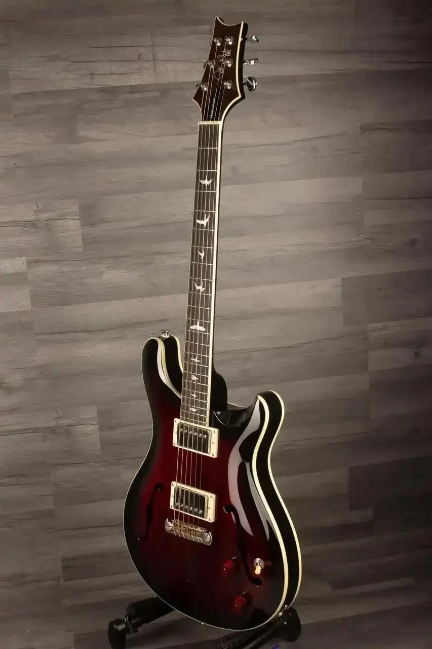 USED PRS SE Hollowbody Standard Fire Red Burst guitar showcasing its mahogany body and elegant design.